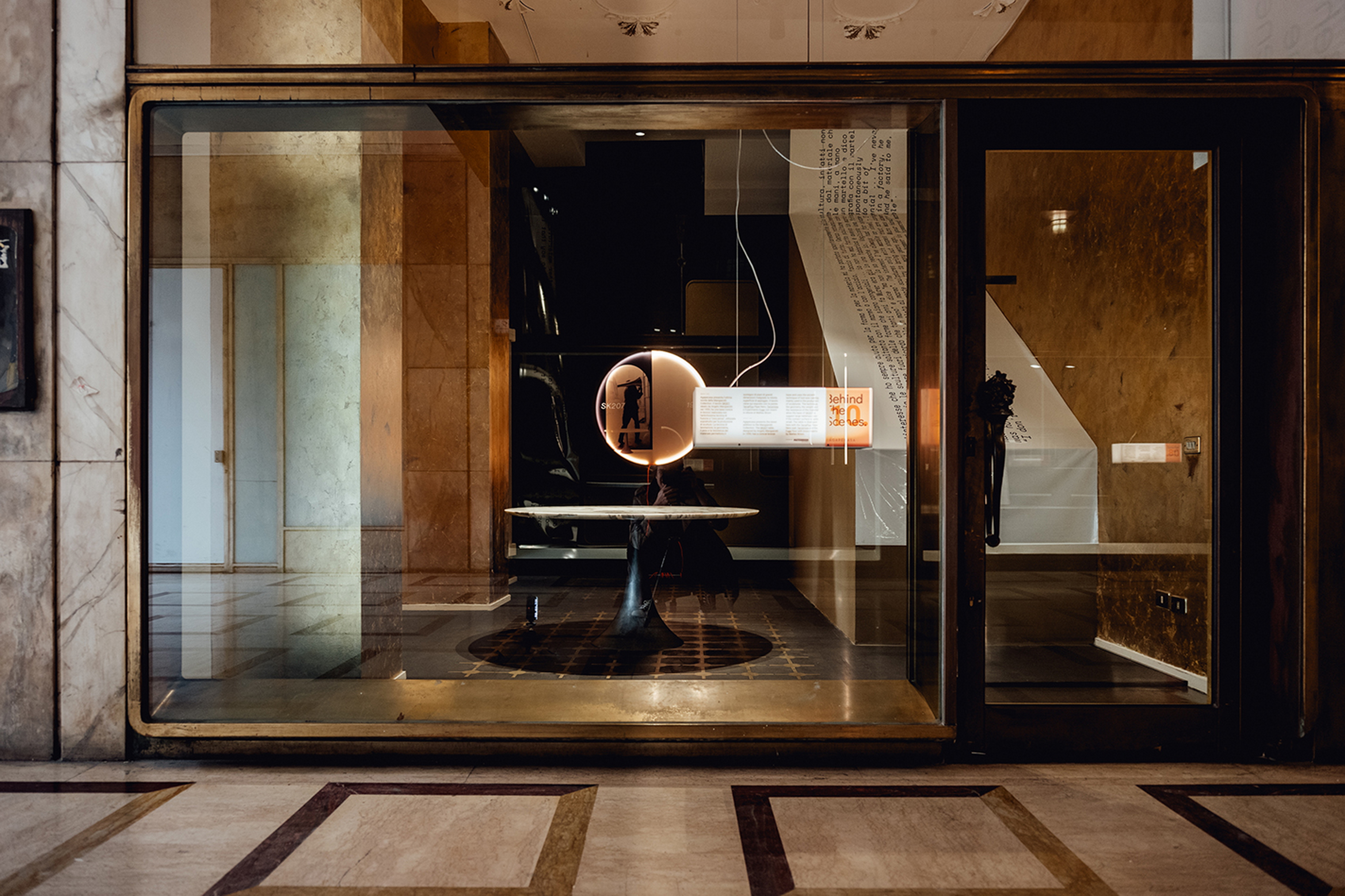 Agape Behibd the Scenes in Galleria Manzoni, Milan, made with Matteo Brioni's TerraTon Floor Smooth Pepe Nero with TerraFrame brass inserts by Marialaura Rossiello Studio Irvine, photo by Matteo Lavazza Seranto
