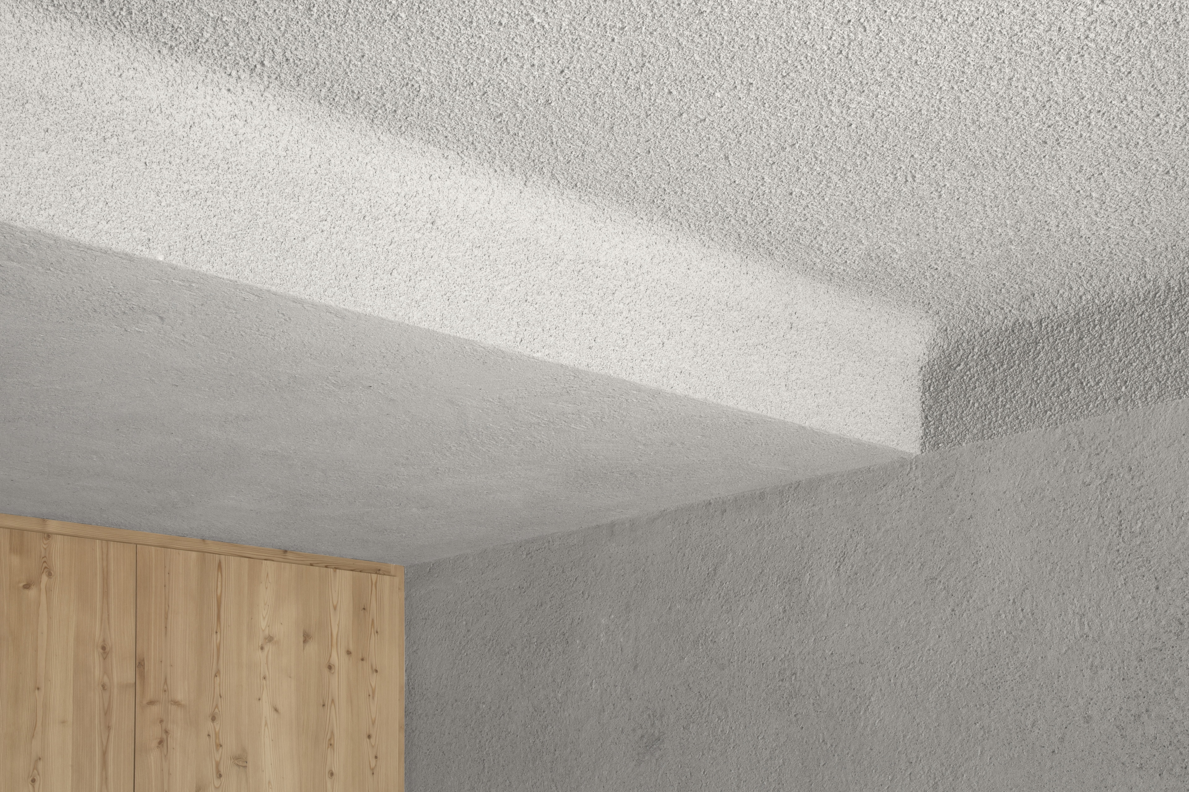 Matteo Brioni's coarse-grained clay plaster MultiTerra Structured Custom color for the walls of a private house in Bolzano by Pedevilla Architects, photo by Josef Gostner