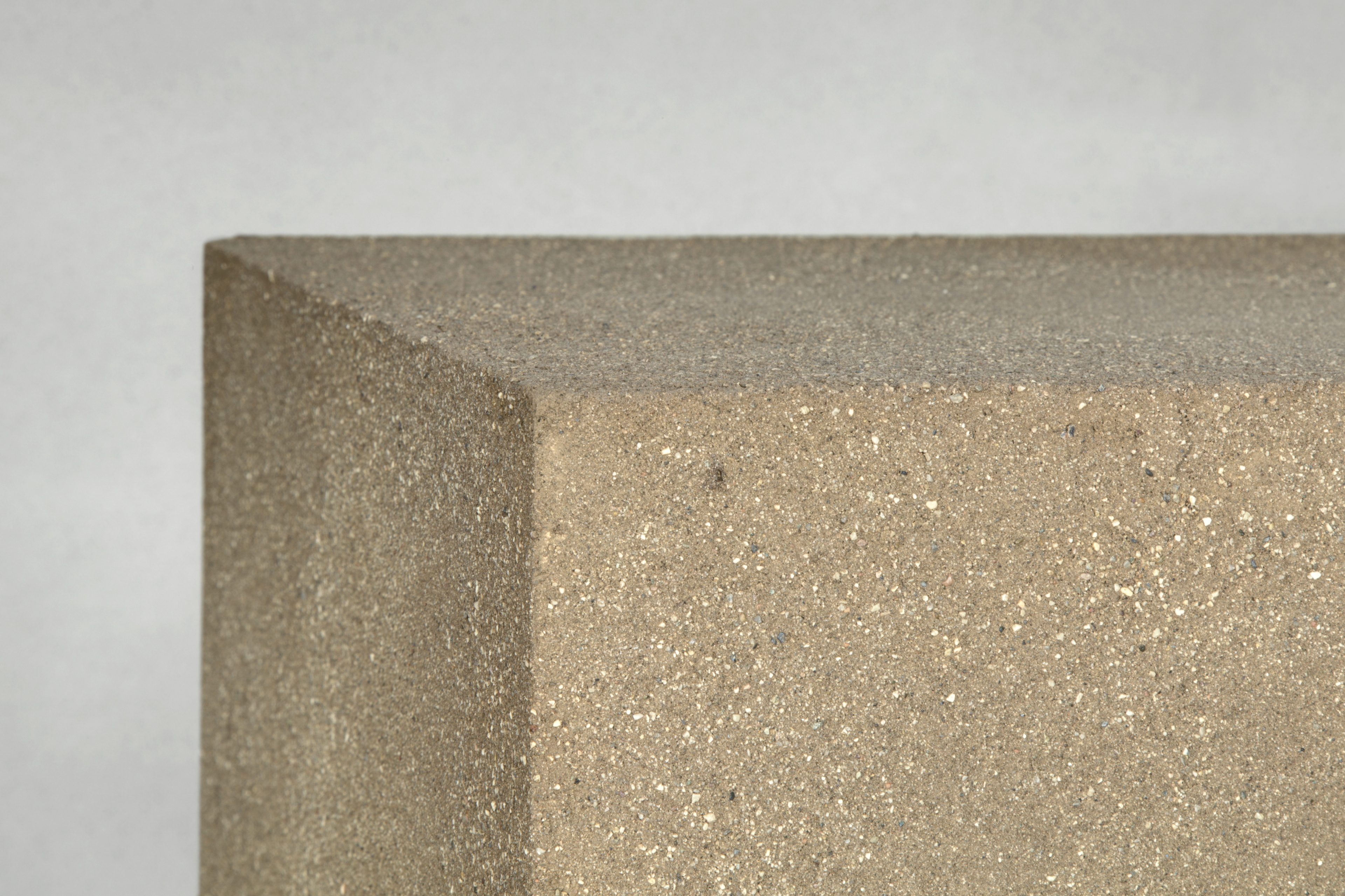 Matteo Brioni's coarse-grained clay plaster MultiTerra Smooth Cacao and Panna colors installed on walls, ceilings and furnitures in a private house in Brunico by Pedevilla Architects