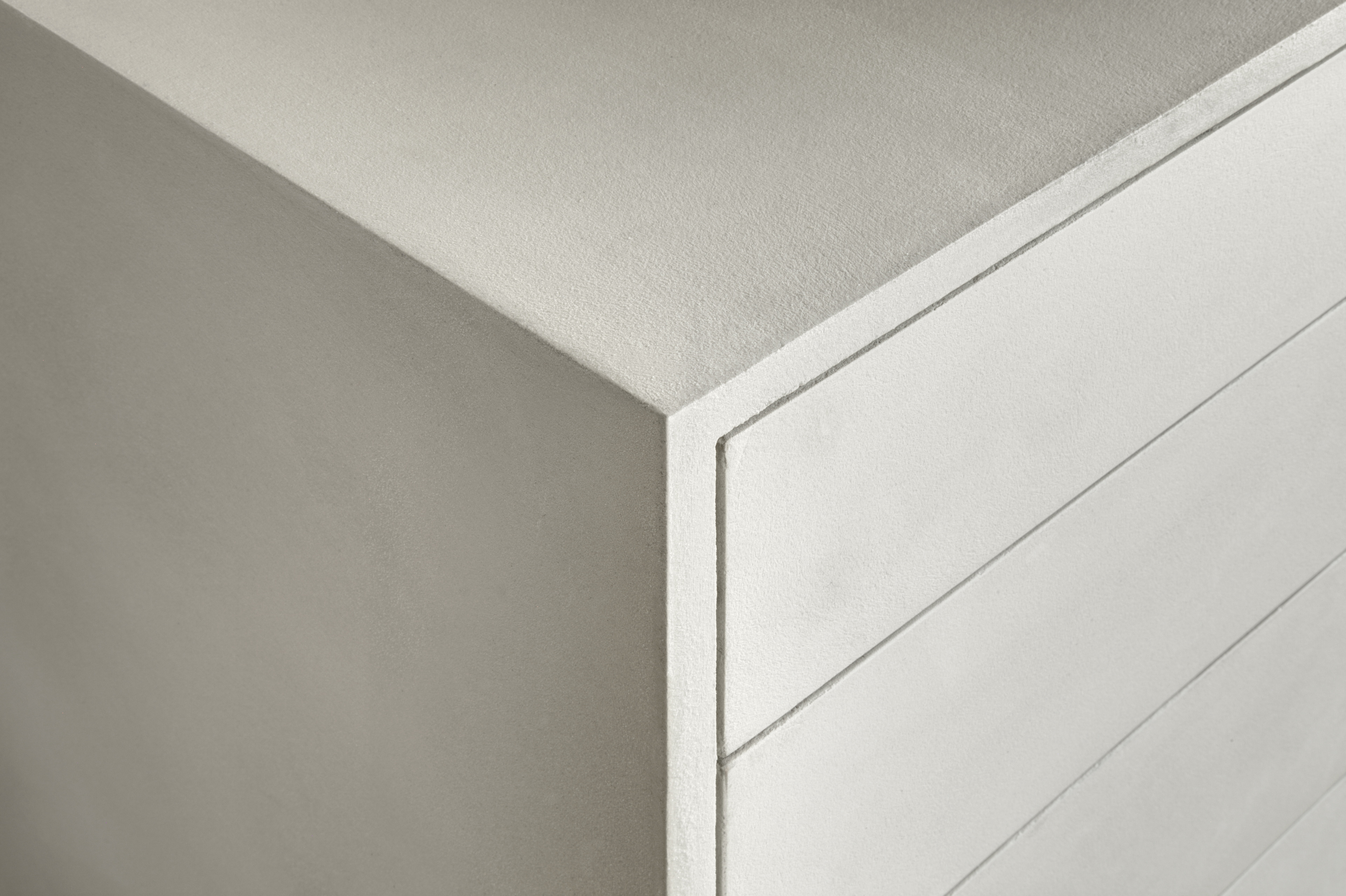 Matteo Brioni's coarse-grained clay plaster MultiTerra Smooth Panna (cream) color installed on walls, ceilings and furnitures in a private house in Brunico by Pedevilla Architects