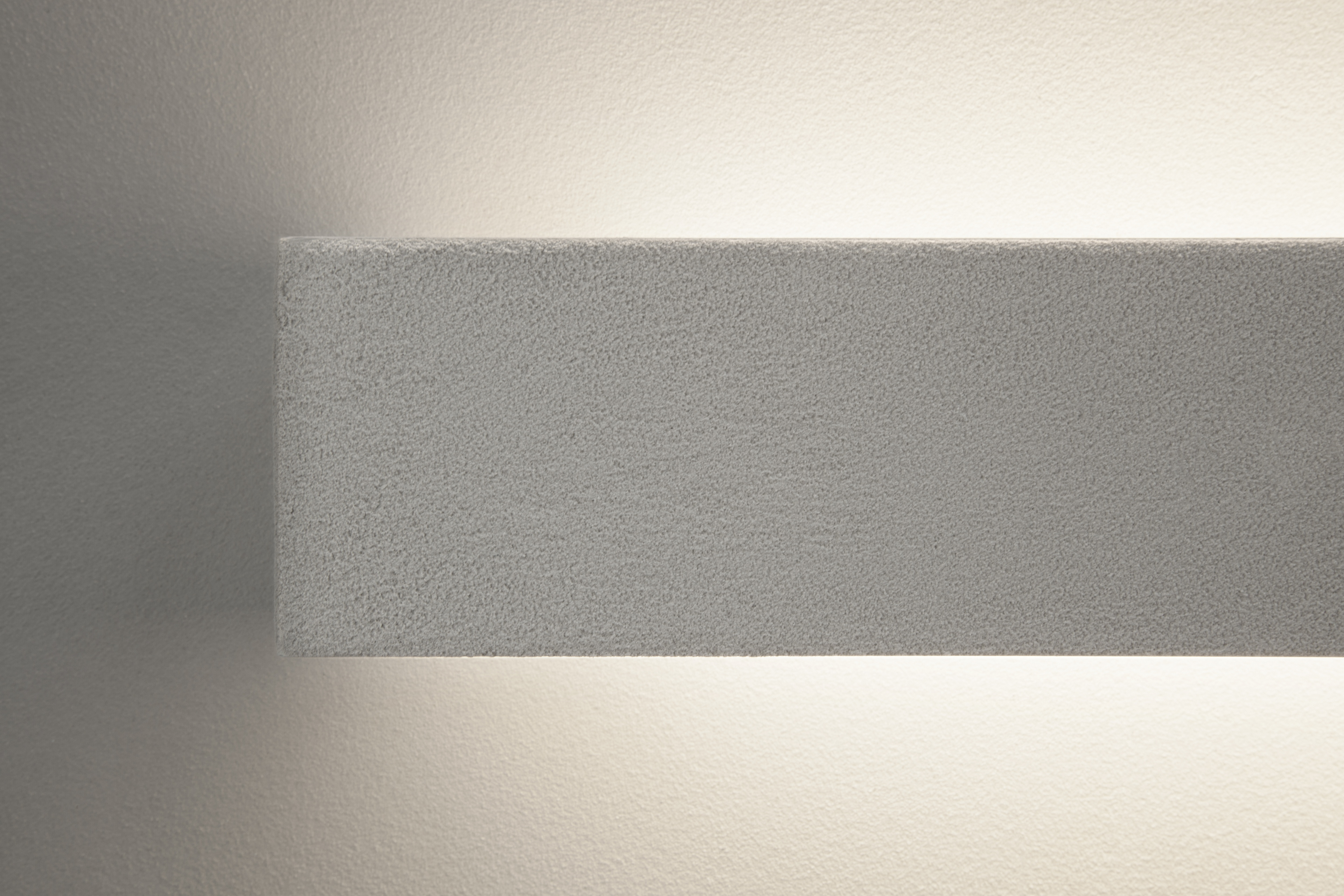 Matteo Brioni's coarse-grained clay plaster MultiTerra Smooth Panna (cream) color installed on walls, ceilings and furnitures in a private house in Brunico by Pedevilla Architects