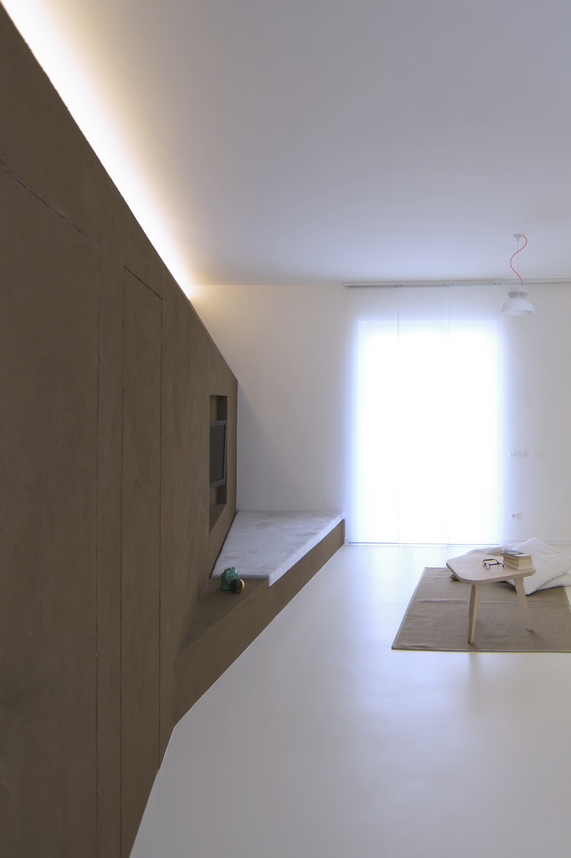 Matteo Brioni's fine-grained clay plaster TerraVista Smooth Cacao color for a private apartment in Turin by R3Architetti, photo by Carlo Mossetti