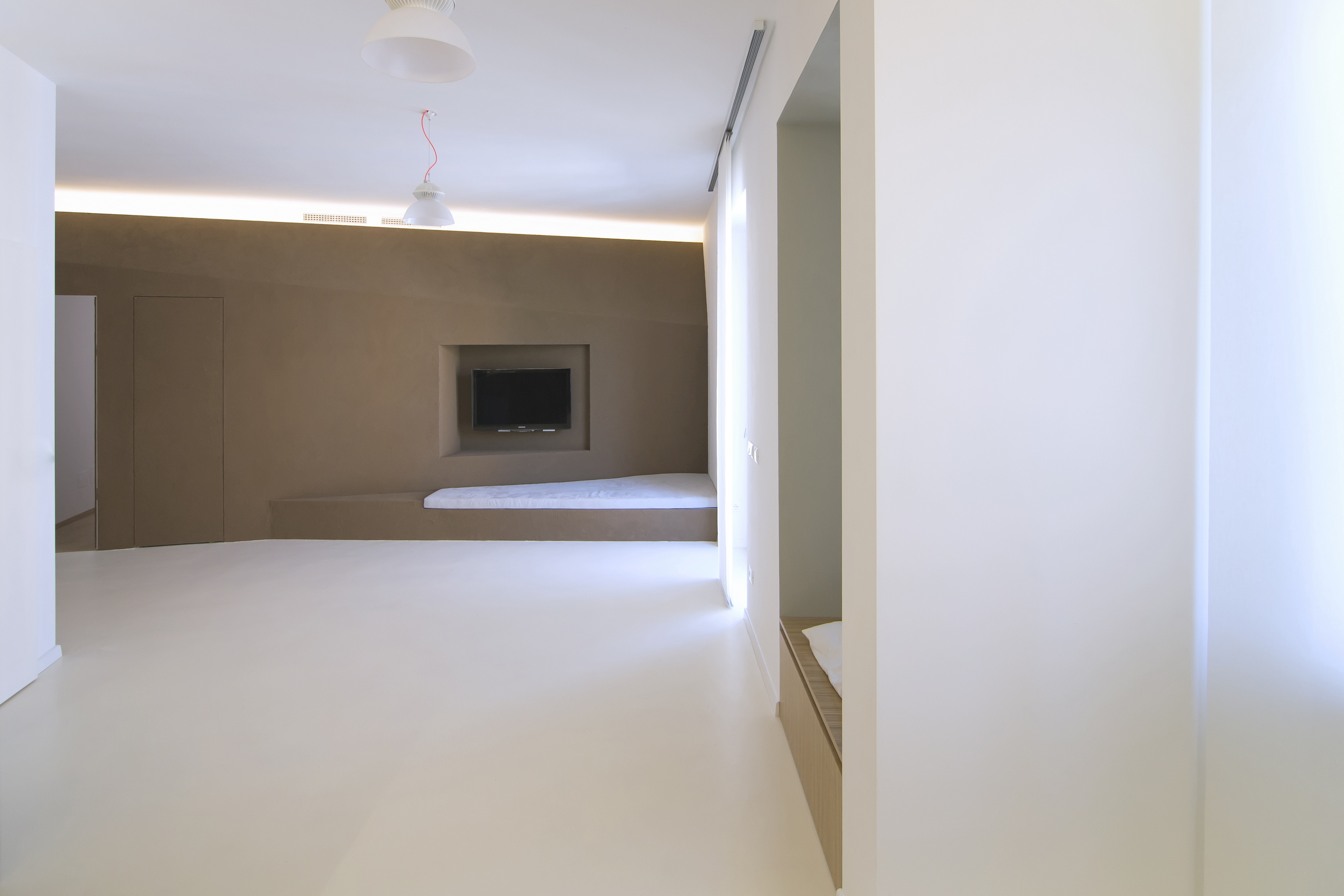 Matteo Brioni's fine-grained clay plaster TerraVista Smooth Cacao color for a private apartment in Turin by R3Architetti, photo by Carlo Mossetti