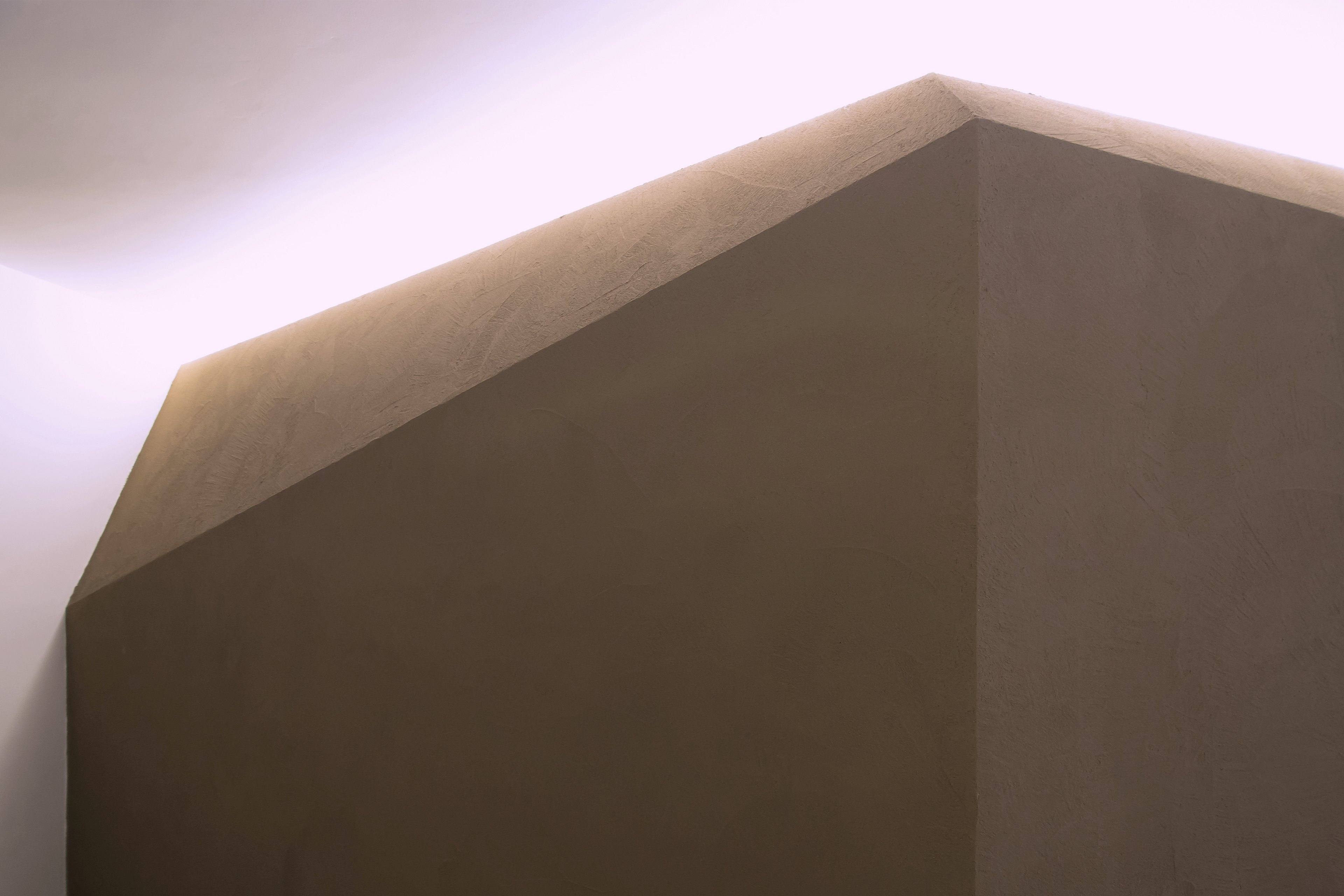 Matteo Brioni's fine-grained clay plaster TerraVista Smooth Cacao color for a private apartment in Turin by R3Architetti, photo by Carlo Mossetti