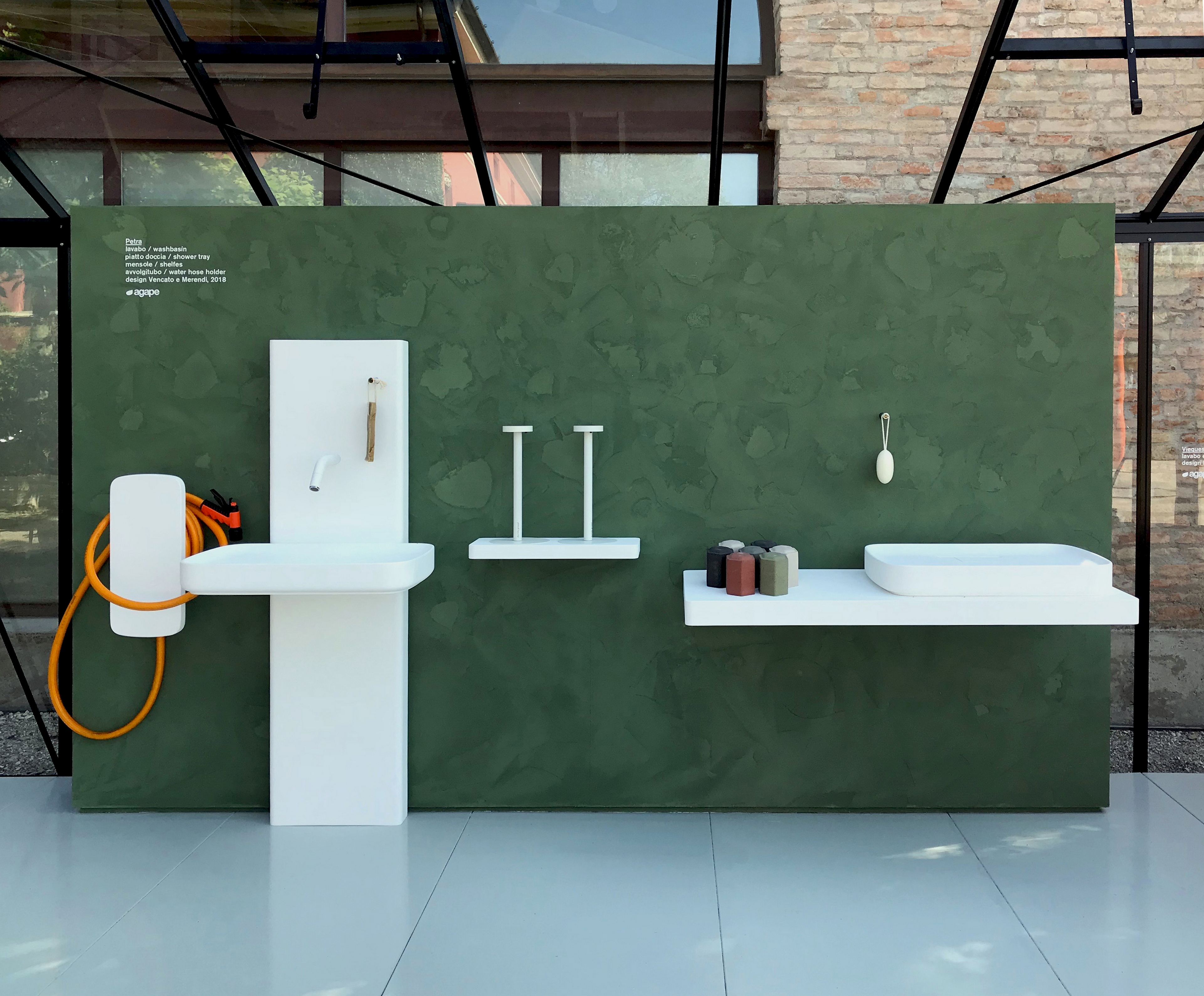 Matteo Brioni's fine-grained clay plaster TerraVista Smooth Custom color with Plus customization installed on bathroom wall, design by Benedini Associati