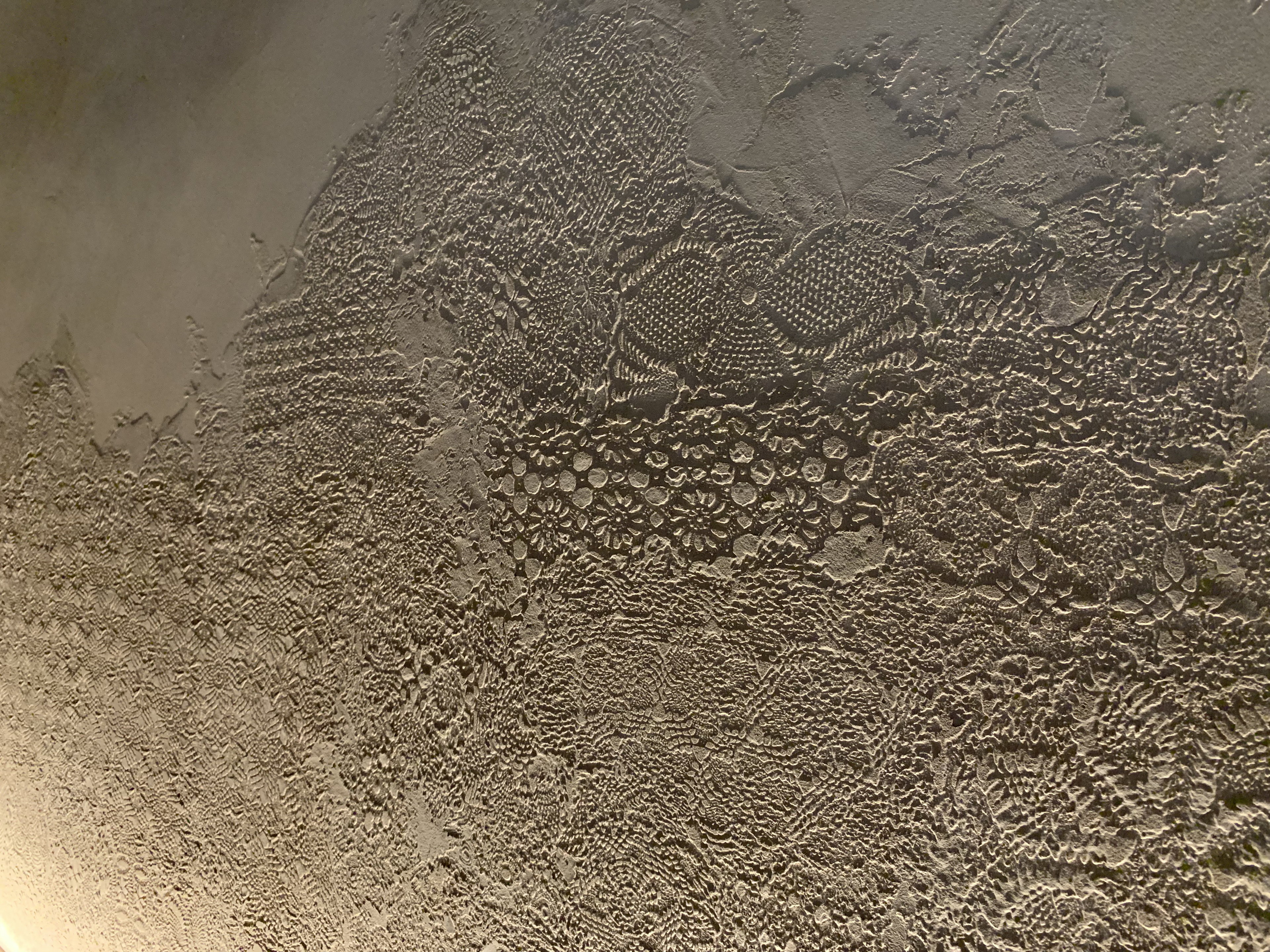 Matteo Brioni's textured clay plaster TerraEvoca 2 Layers Cipria (powder color) applied on walls in a private apartment in Verona, project by Emanuele Soldi