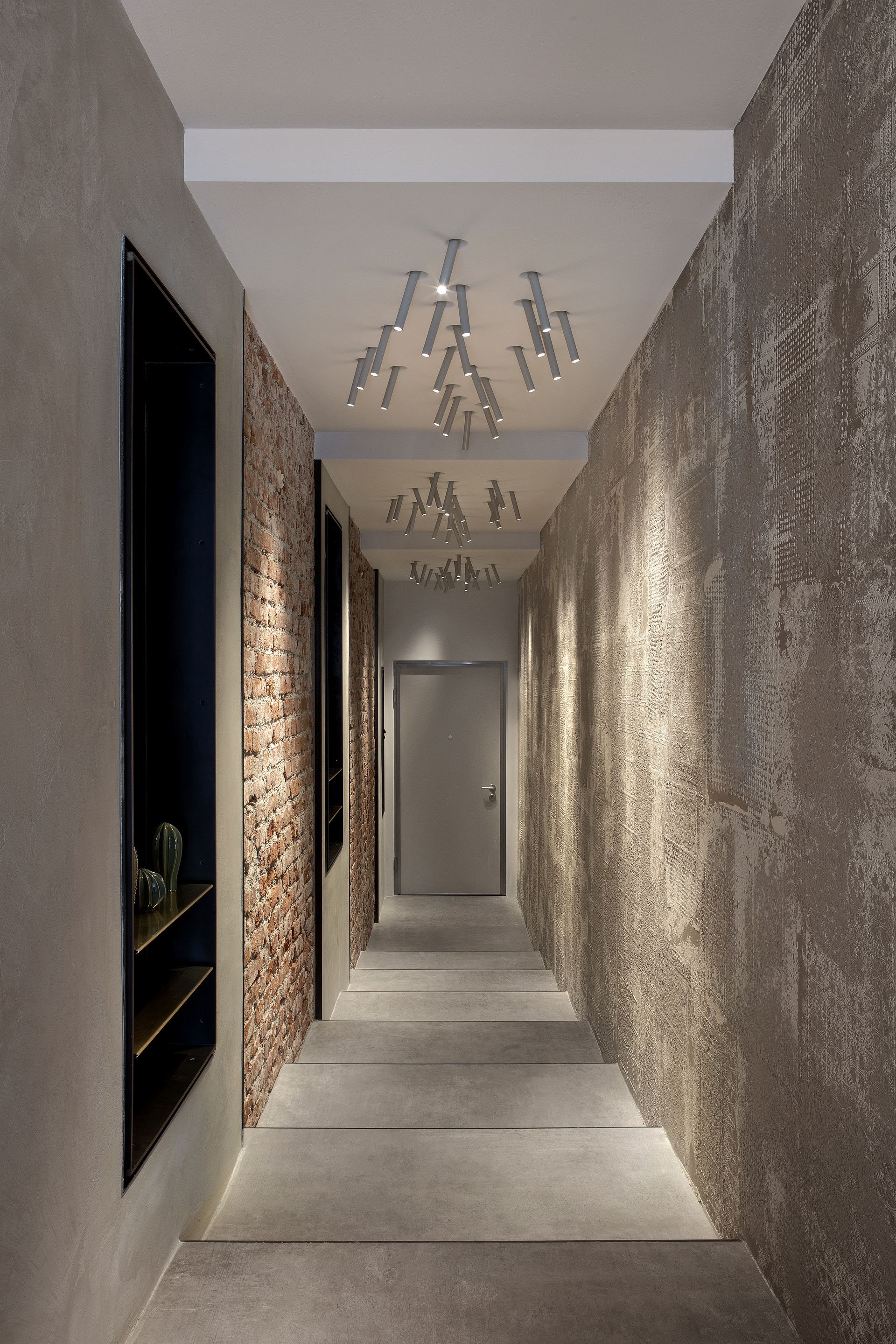 Matteo Brioni's textured clay plaster TerraEvoca 4 Layers Sale Grigio (gray salt) color appllied on walls and doors in a private house in Milan, project by NM Architetti, photo by Barbara Corsico