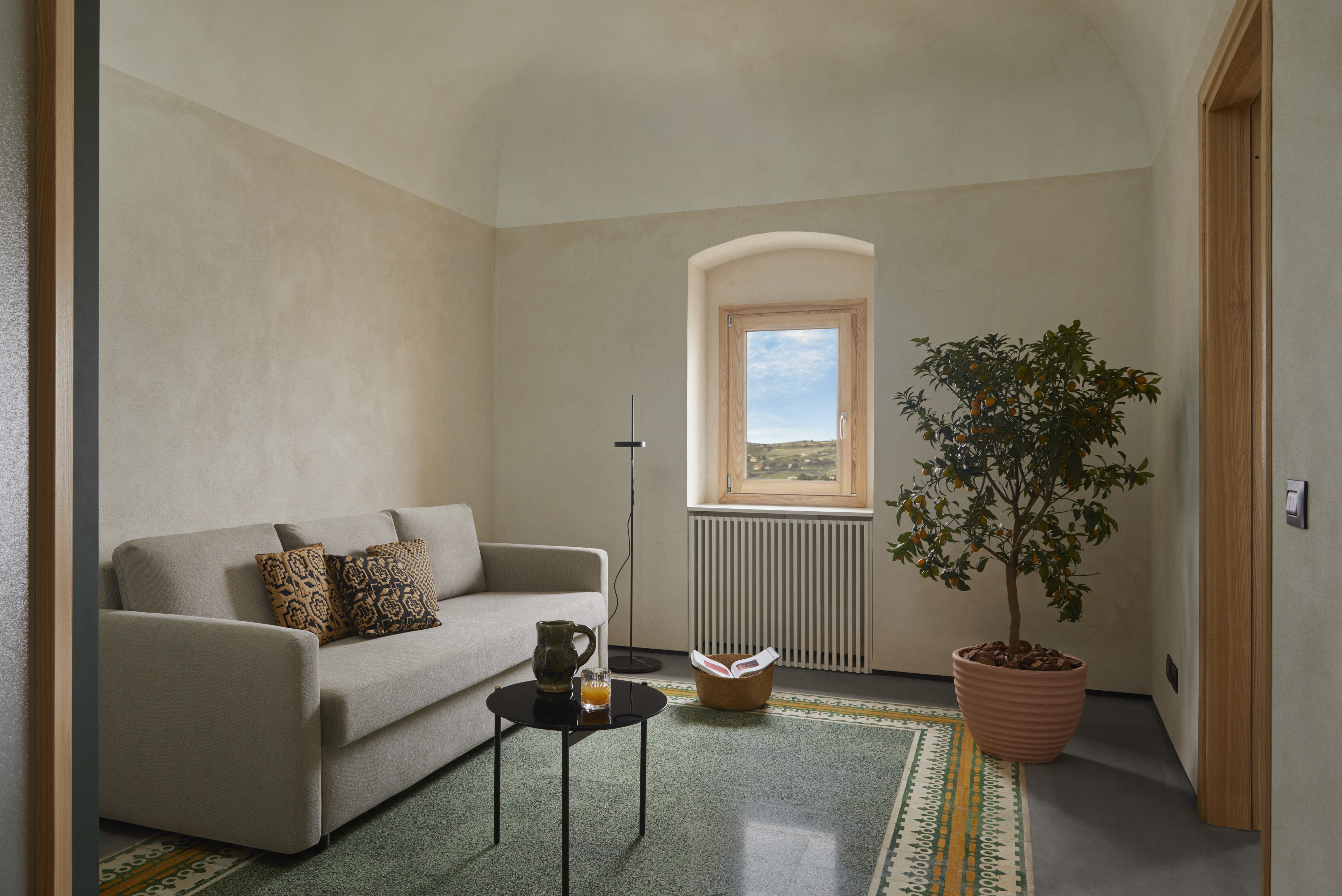 Matteo Brioni's mineral coating TerraFloor Smooth Sale Grigio (gray salt) color on floors for Airbnb 1 Euro House in Sambuca di Sicilia by Studio Didea, photo by Claudia Zalla