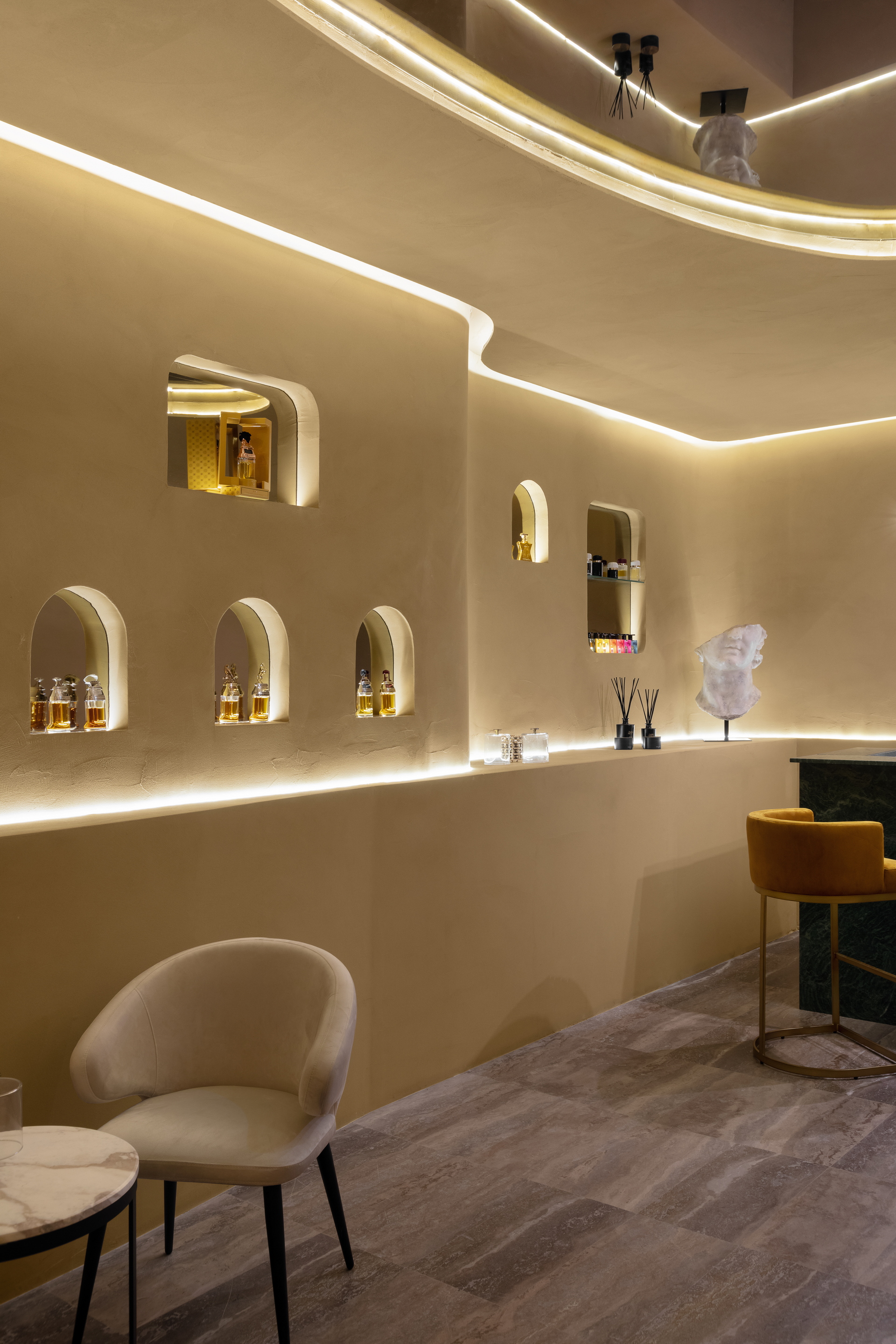 Matteo Brioni's reinforced fine-grained clay plaster TerraVista Plus Smooth Senape (mustard color) applied on walls in the Profumo shop in Naples, project by Primo Atelier, photo by Carlo Oriente