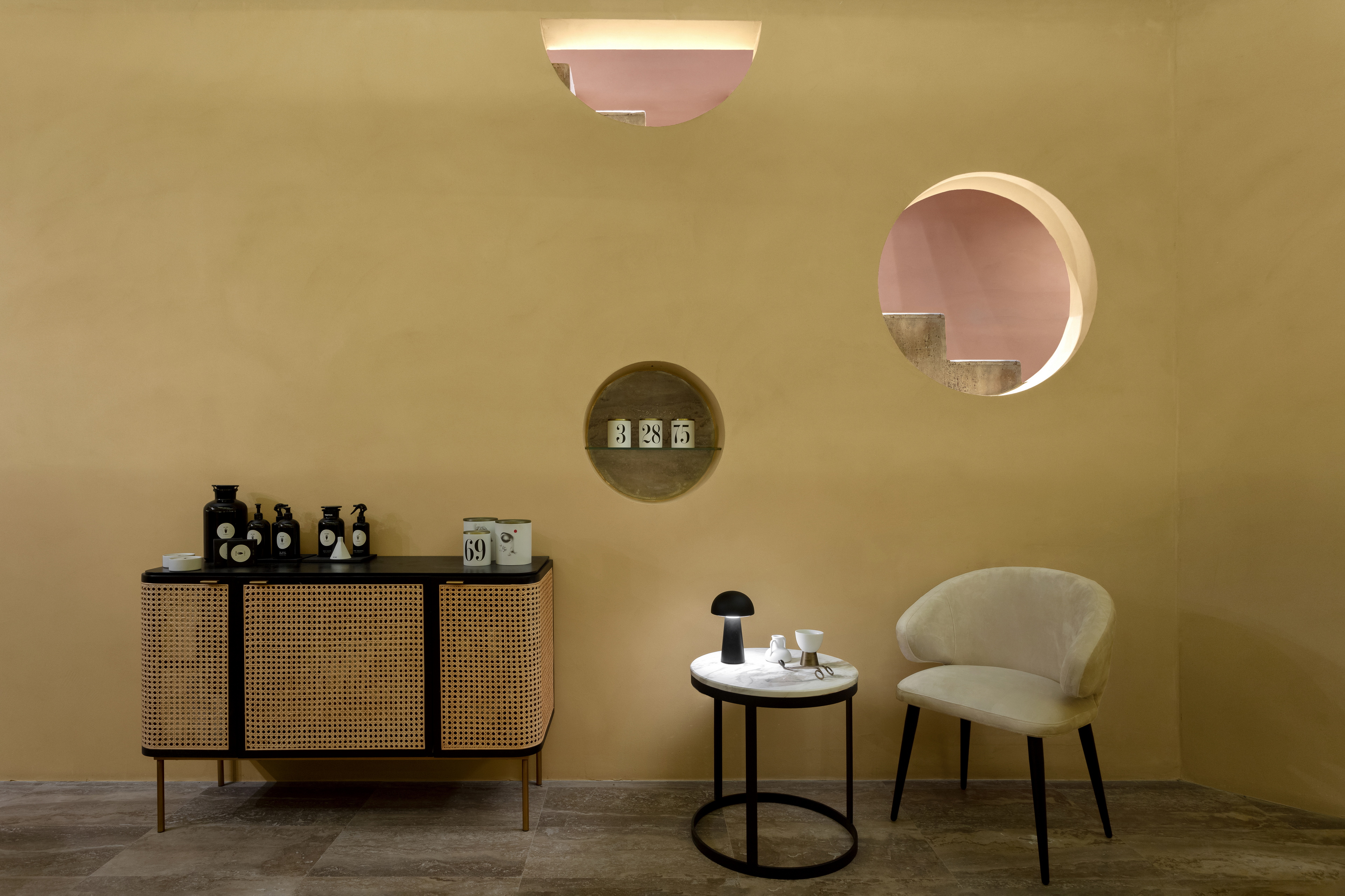 Matteo Brioni's reinforced fine-grained clay plaster TerraVista Plus Smooth Senape (mustard color) applied on walls in the Profumo shop in Naples, project by Primo Atelier, photo by Carlo Oriente