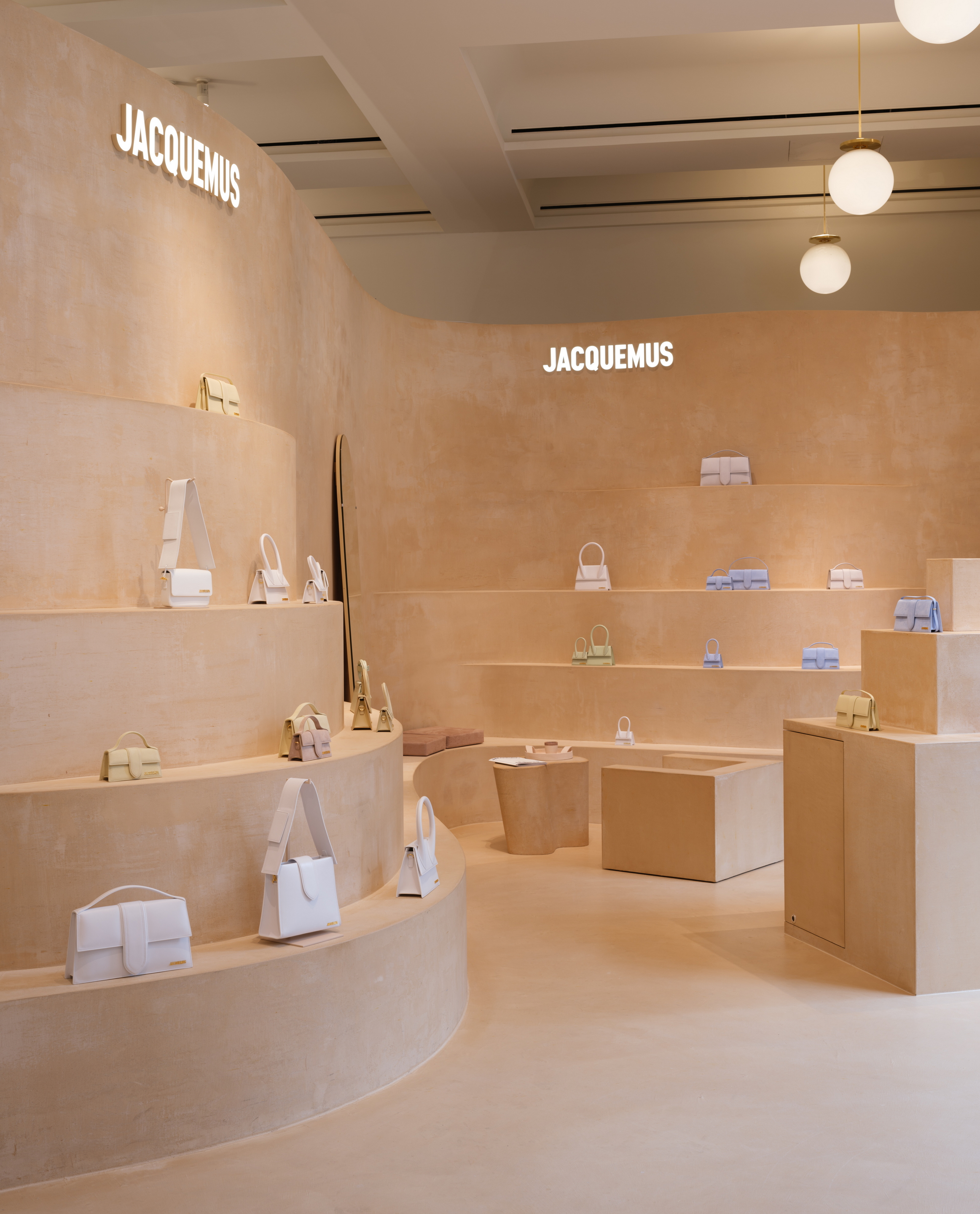 Fine-grained mixtures of clays and mineral binders TerraTon Floor and TerraTon Plus Wall both Smooth and with the same bespoke color applied to floor, walls and shelves of Jaquemus boutique into the London Selfridges. Project by AMO-OMA. Photo by Lewis Ronald