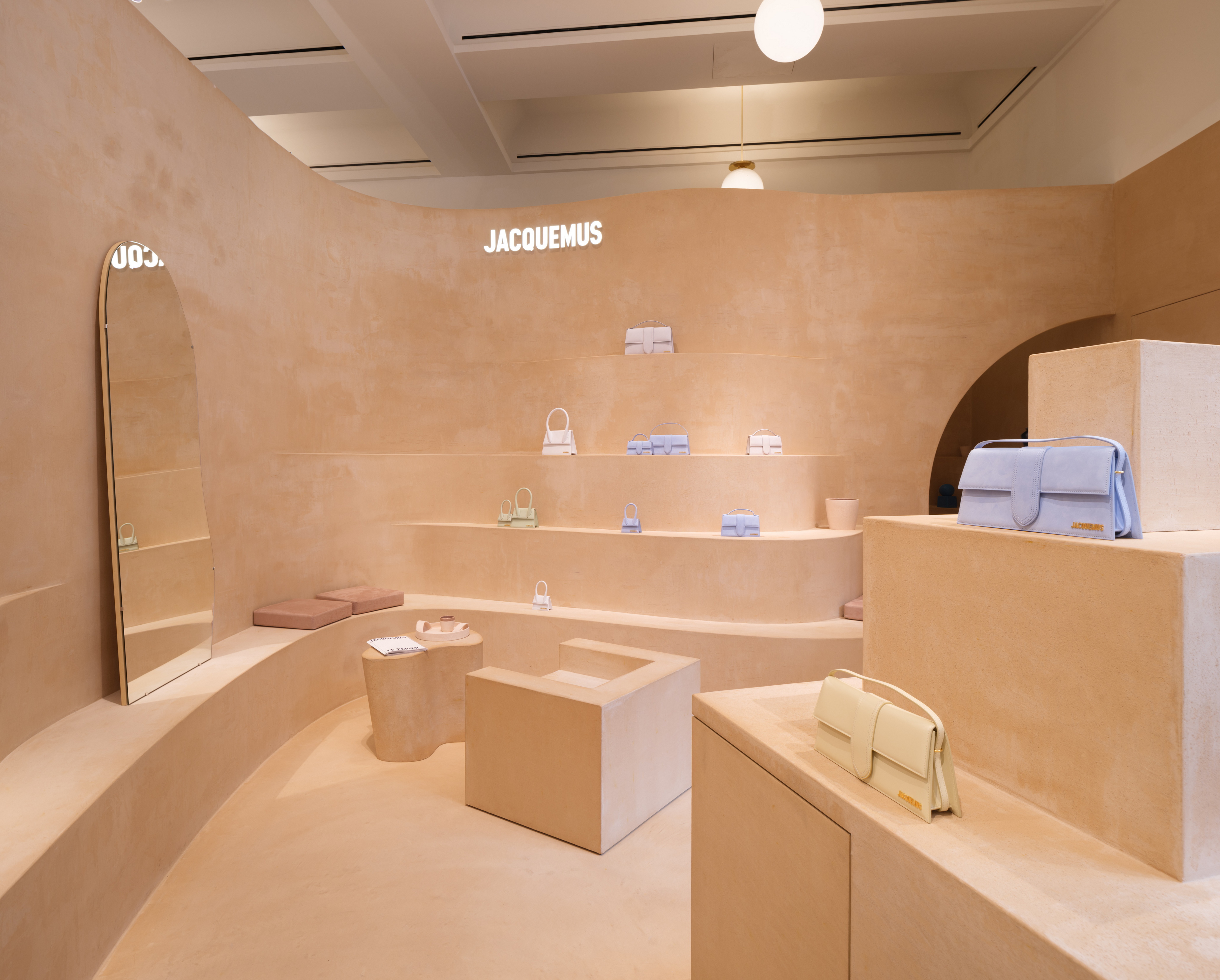 Fine-grained mixtures of clays and mineral binders TerraTon Floor and TerraTon Plus Wall both Smooth and with the same bespoke color applied to floor, walls and shelves of Jaquemus boutique into the London Selfridges. Project by AMO-OMA. Photo by Lewis Ronald