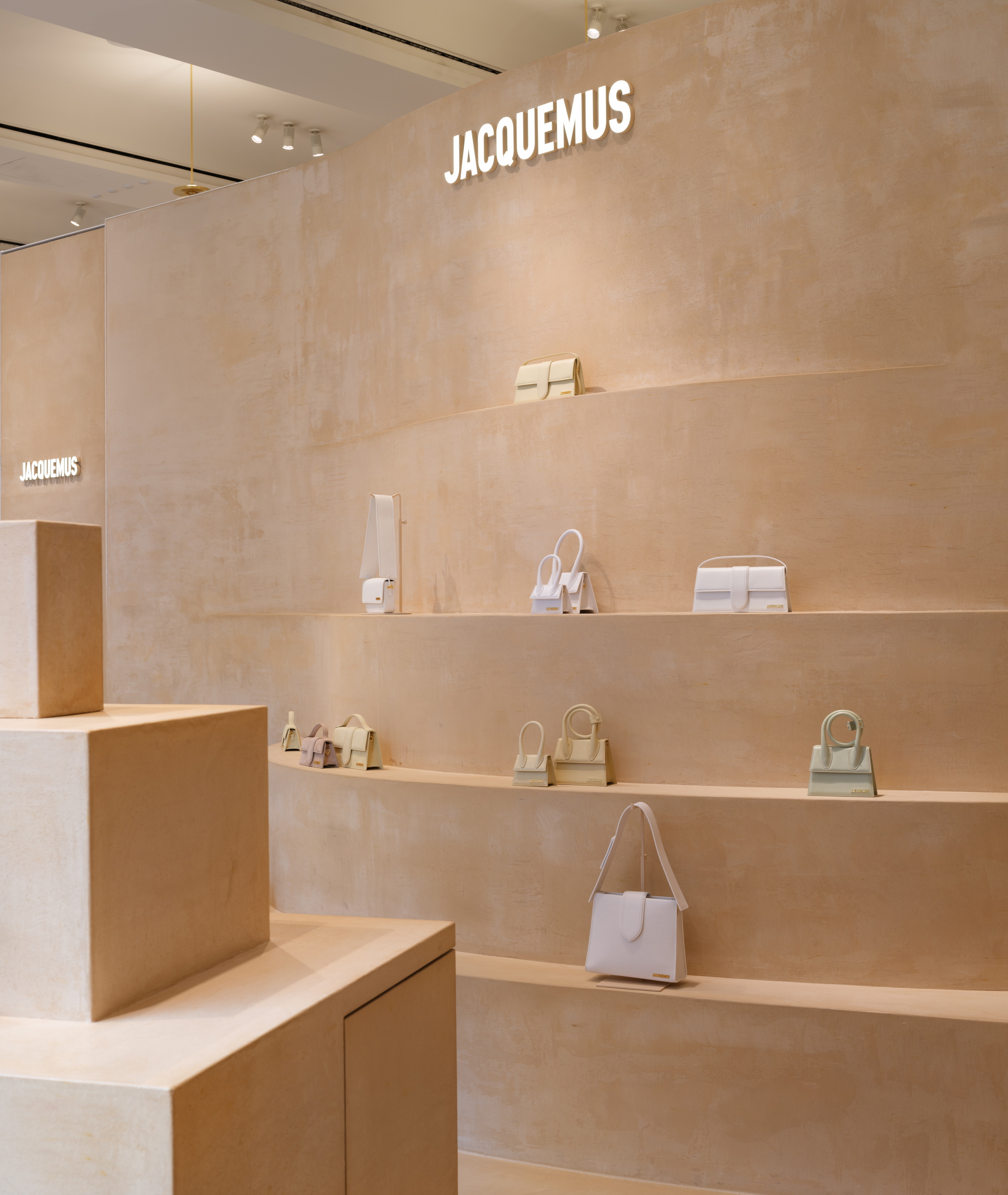 Fine-grained mixtures of clays and mineral binders TerraTon Floor and TerraTon Plus Wall both Smooth and with the same bespoke color applied to floor, walls and shelves of Jaquemus boutique into the London Selfridges. Project by AMO-OMA. Photo by Lewis Ronald