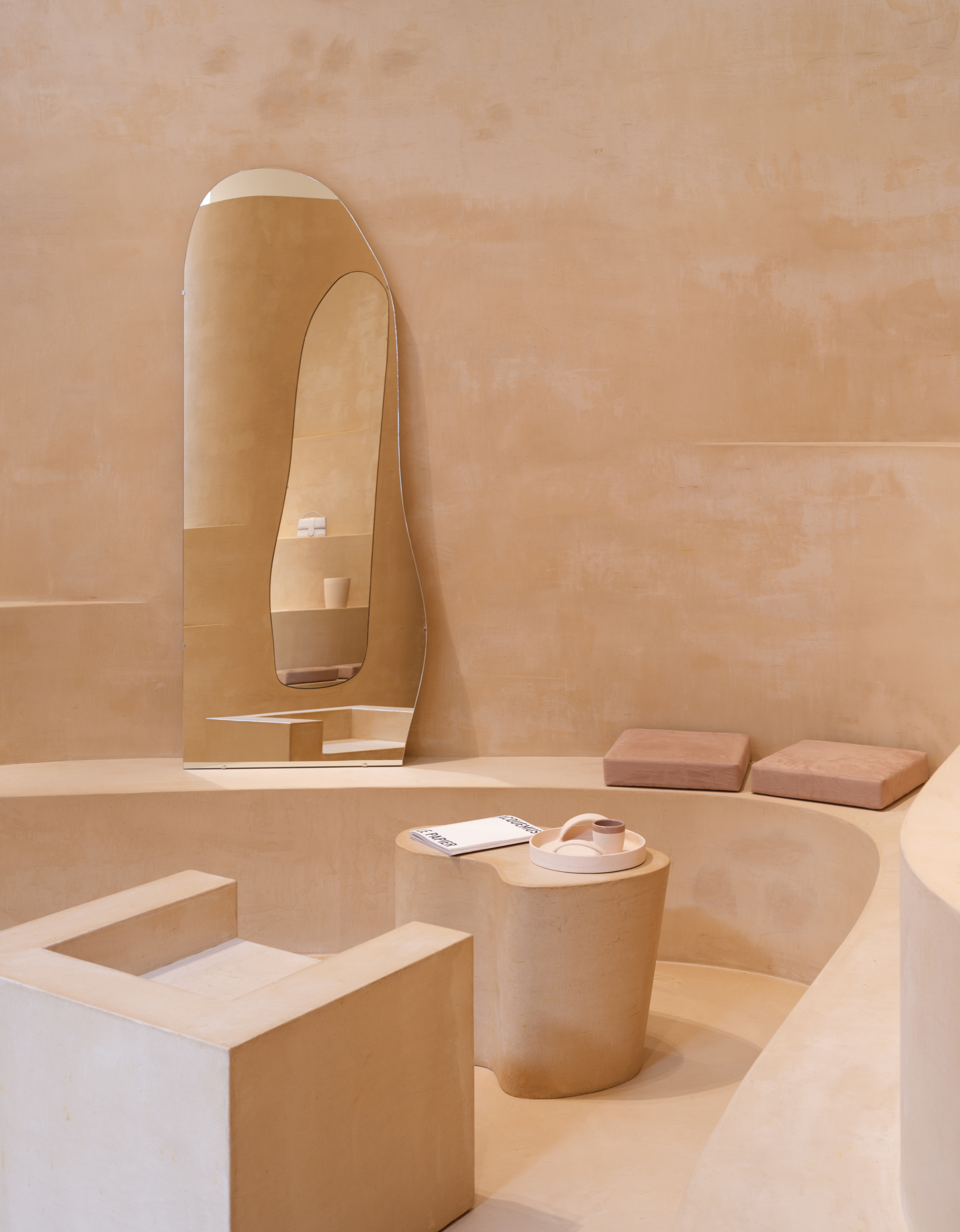 Fine-grained mixtures of clays and mineral binders TerraTon Floor and TerraTon Plus Wall both Smooth and with the same bespoke color applied to floor, walls and shelves of Jaquemus boutique into the London Selfridges. Project by AMO-OMA. Photo by Lewis Ronald