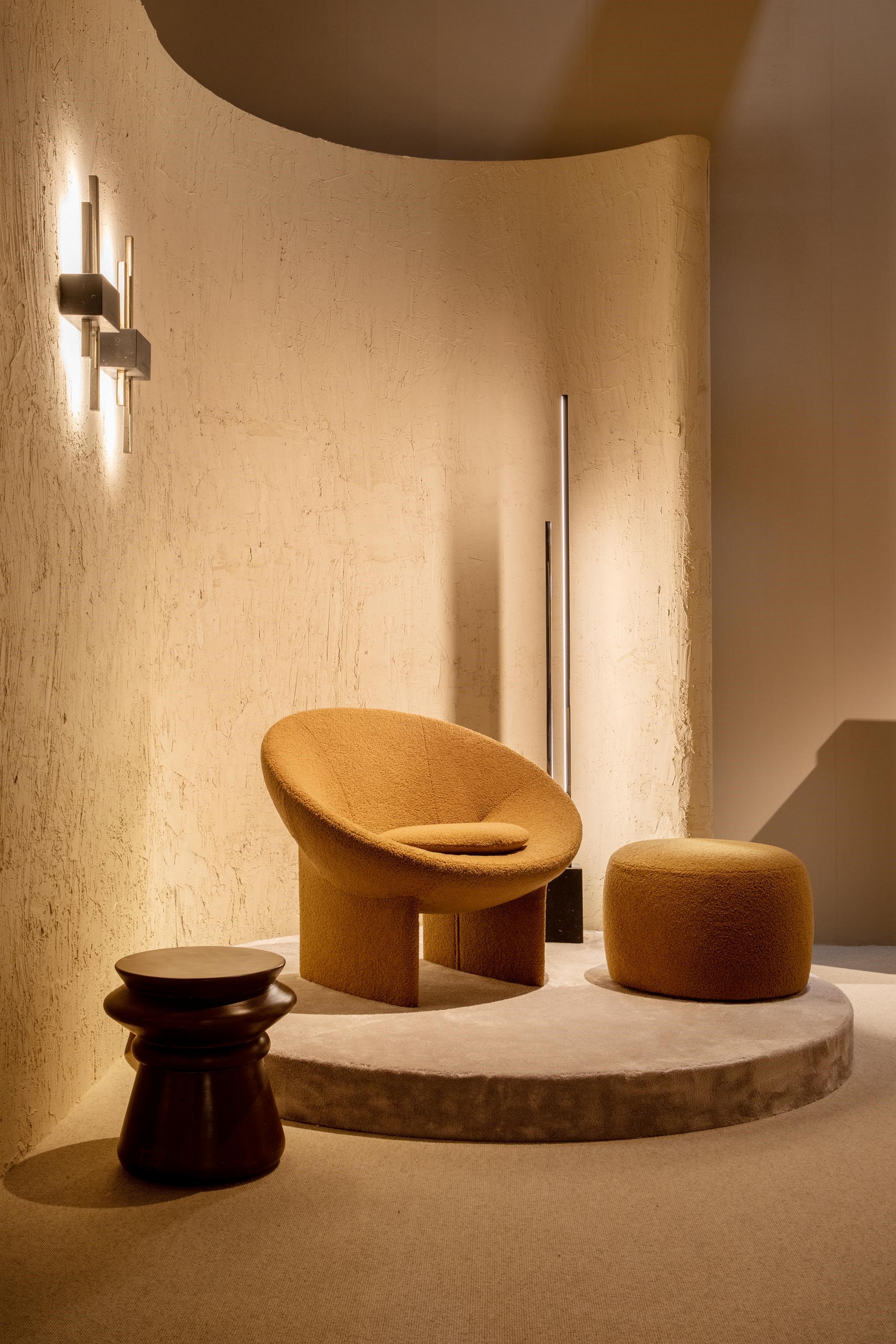 Fine-grained clay plaster TerraVista Smooth and very coarse-grained clay finishing MultiTerra Structured, both applied to walls of Trussardi Casa display at Milan Furniture Fair in a Panna (cream) color shade. Design and photo by Luxury Living Group