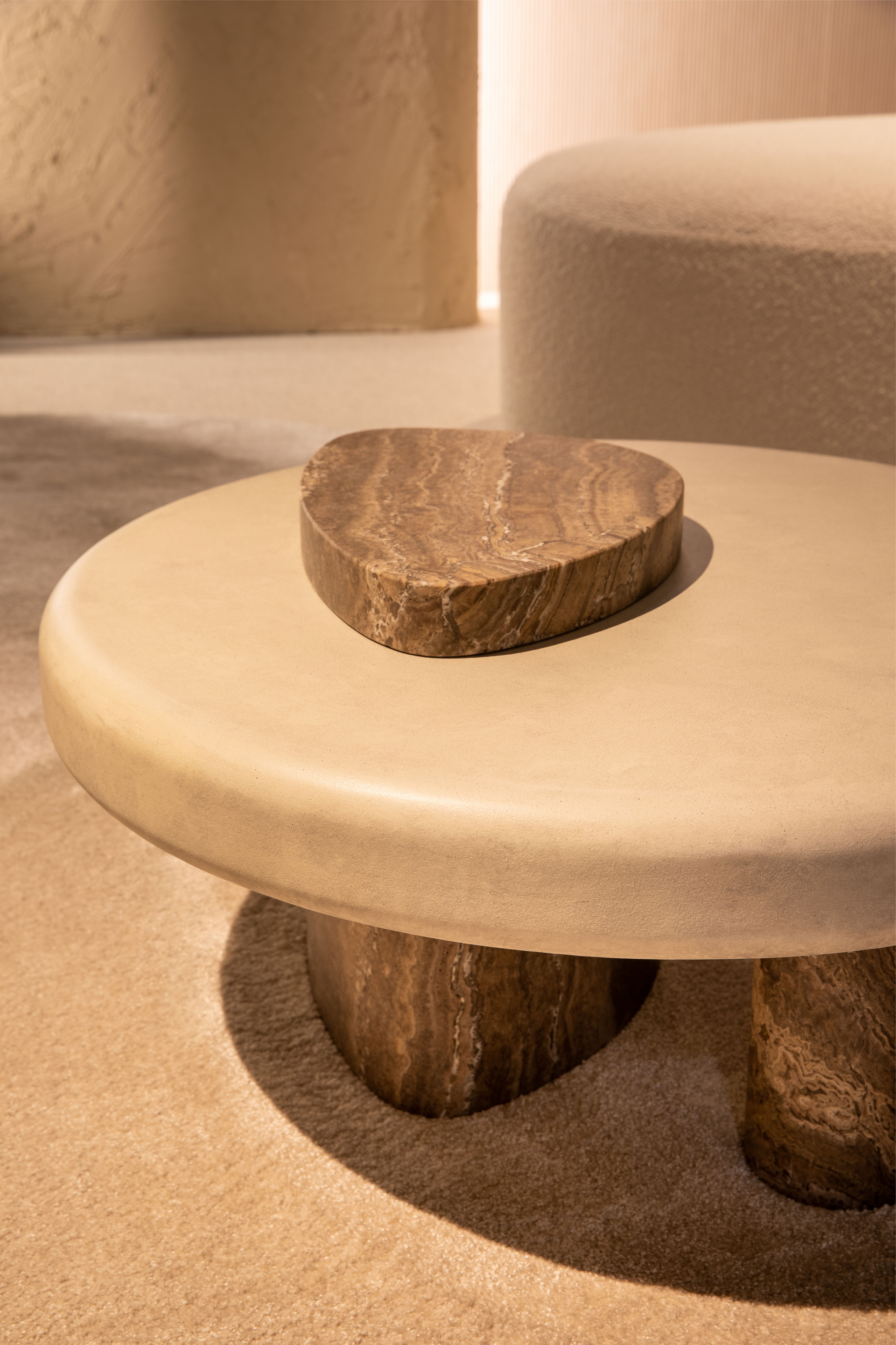 Fine-grained clay plaster TerraVista Smooth and very coarse-grained clay finishing MultiTerra Structured, both applied to walls of Trussardi Casa display at Milan Furniture Fair in a Panna (cream) color shade. Design and photo by Luxury Living Group