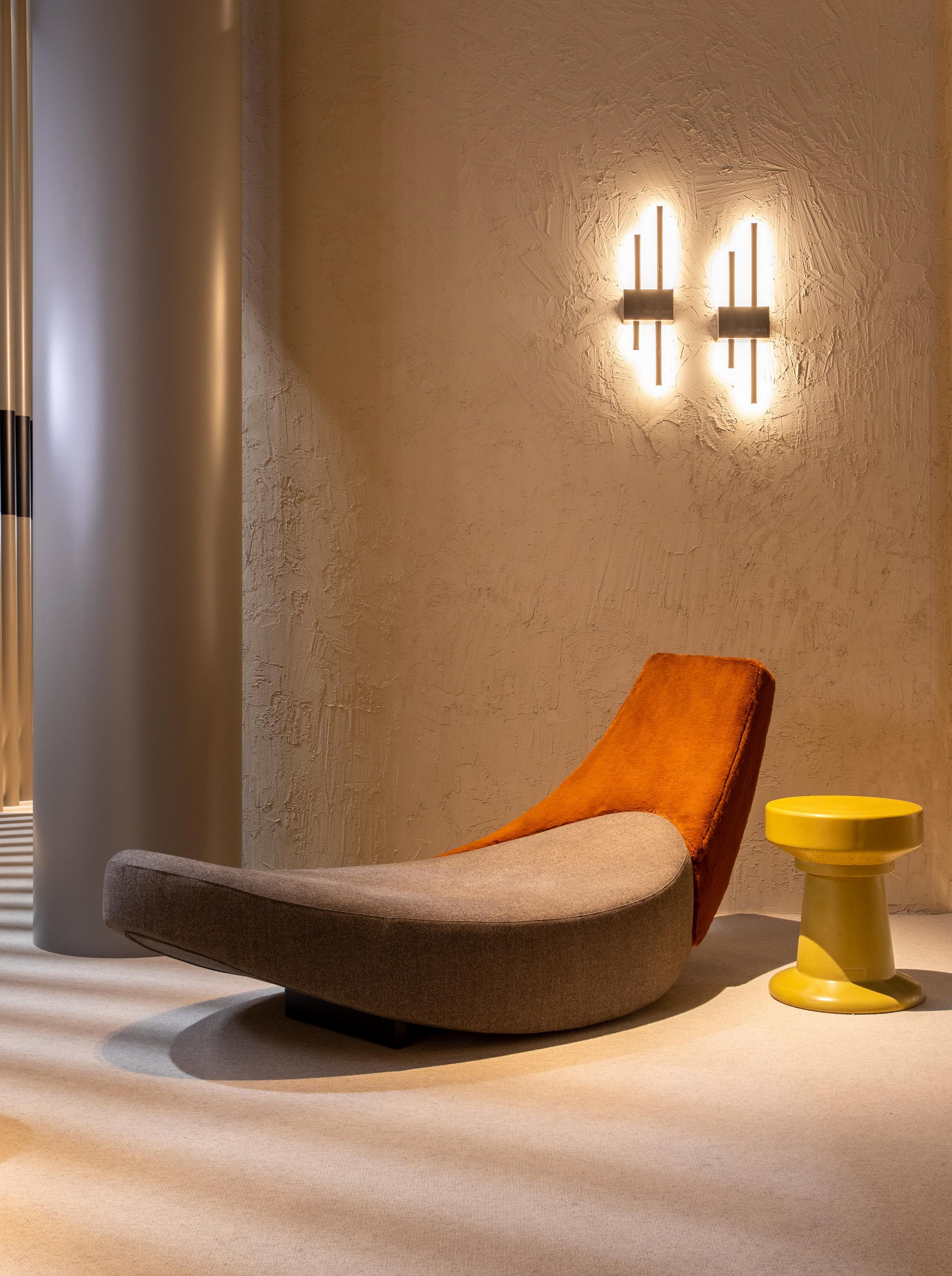 Very coarse-grained clay finishing MultiTerra Structured Panna (cream) color applied to walls of Trussardi Casa display at Milan Furniture Fair. Design and photo by Luxury Living Group