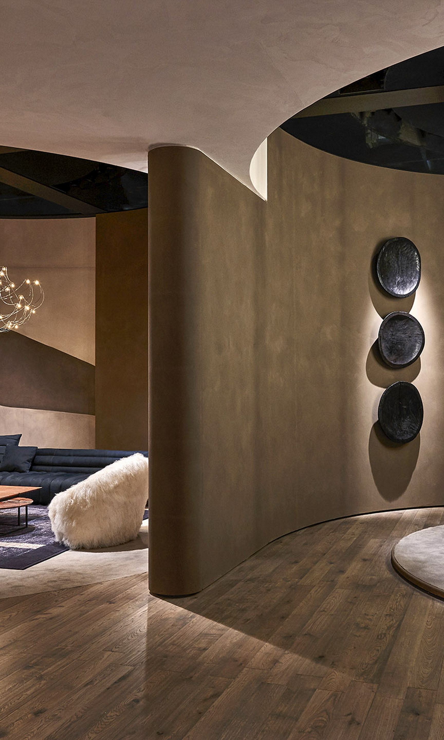 Natural clay paint TerraSilk Structured Sale Grigio (gray salt) and bespoke Pece colors by Matteo Brioni for Baxter stand surfaces at imm Cologne 2020. Design by Baxter, photo by James Stokes courtesy of Baxter