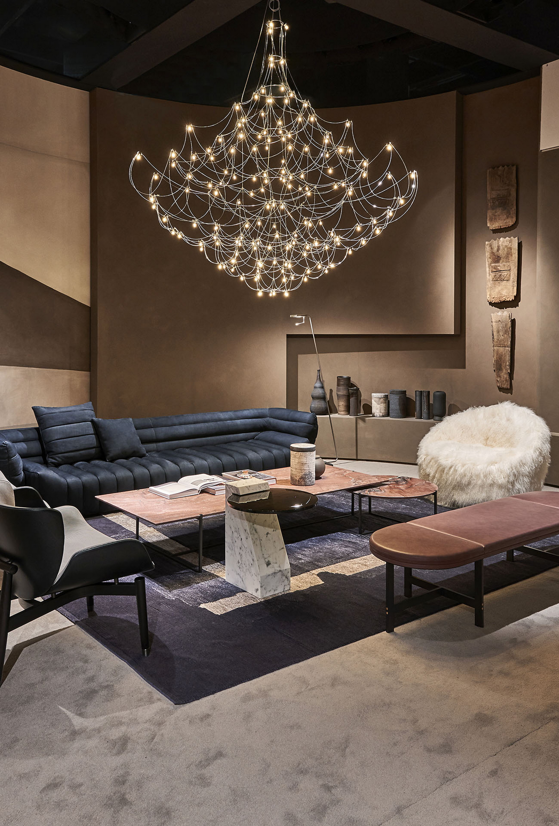 Natural clay paint TerraSilk Structured Sale Grigio (gray salt) and bespoke Pece colors by Matteo Brioni for Baxter stand surfaces at imm Cologne 2020. Design by Baxter, photo by James Stokes courtesy of Baxter