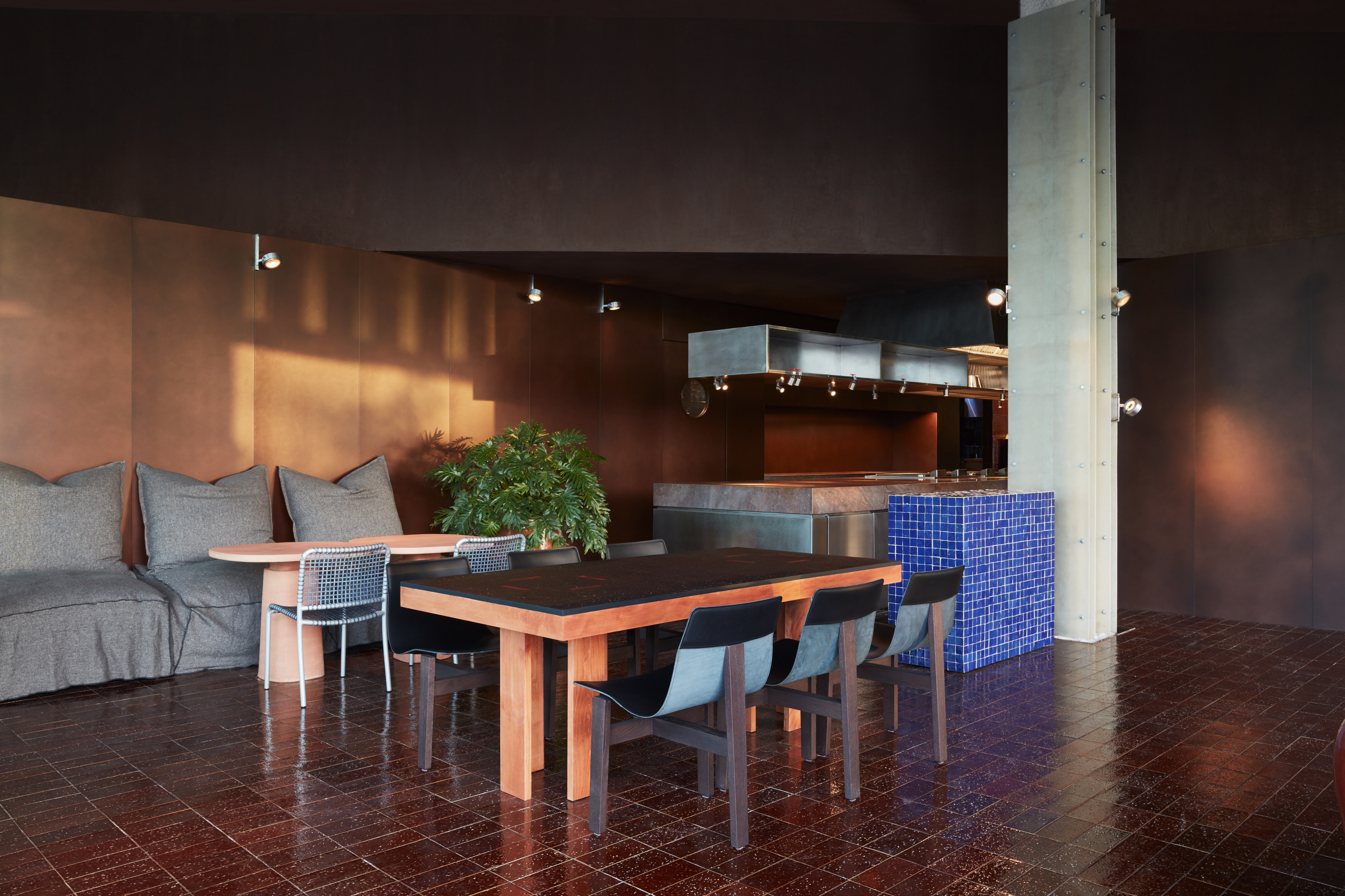 Clay and lime tadelakt finishing plaster TerraCalix Smooth custom color (Deep Maroon) for Terra Al Qana restaurant in Abu Dhabi. Project by Bone Studio