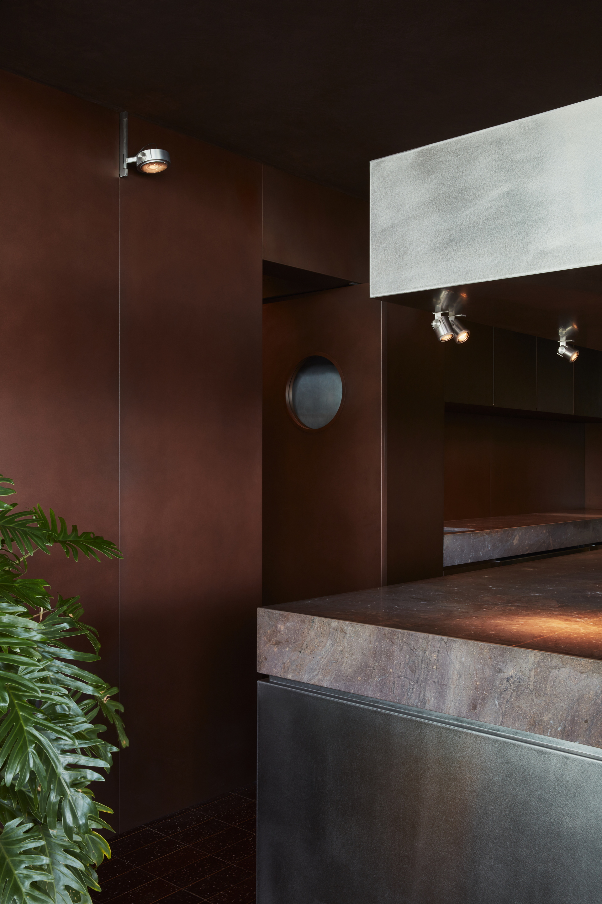 Clay and lime tadelakt finishing plaster TerraCalix Smooth custom color (Deep Maroon) for Terra Al Qana restaurant in Abu Dhabi. Project by Bone Studio