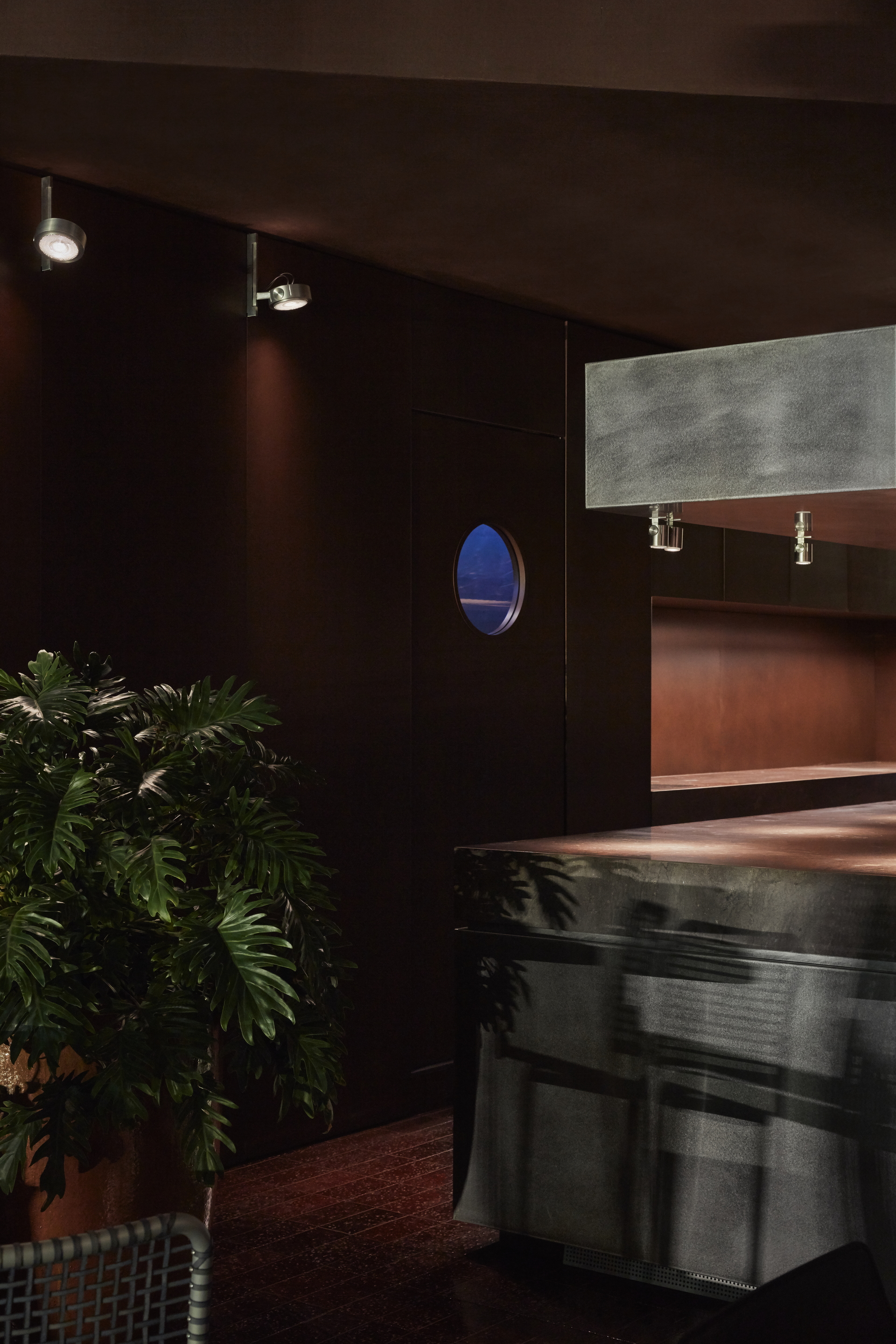 Clay and lime tadelakt finishing plaster TerraCalix Smooth custom color (Deep Maroon) for Terra Al Qana restaurant in Abu Dhabi. Project by Bone Studio