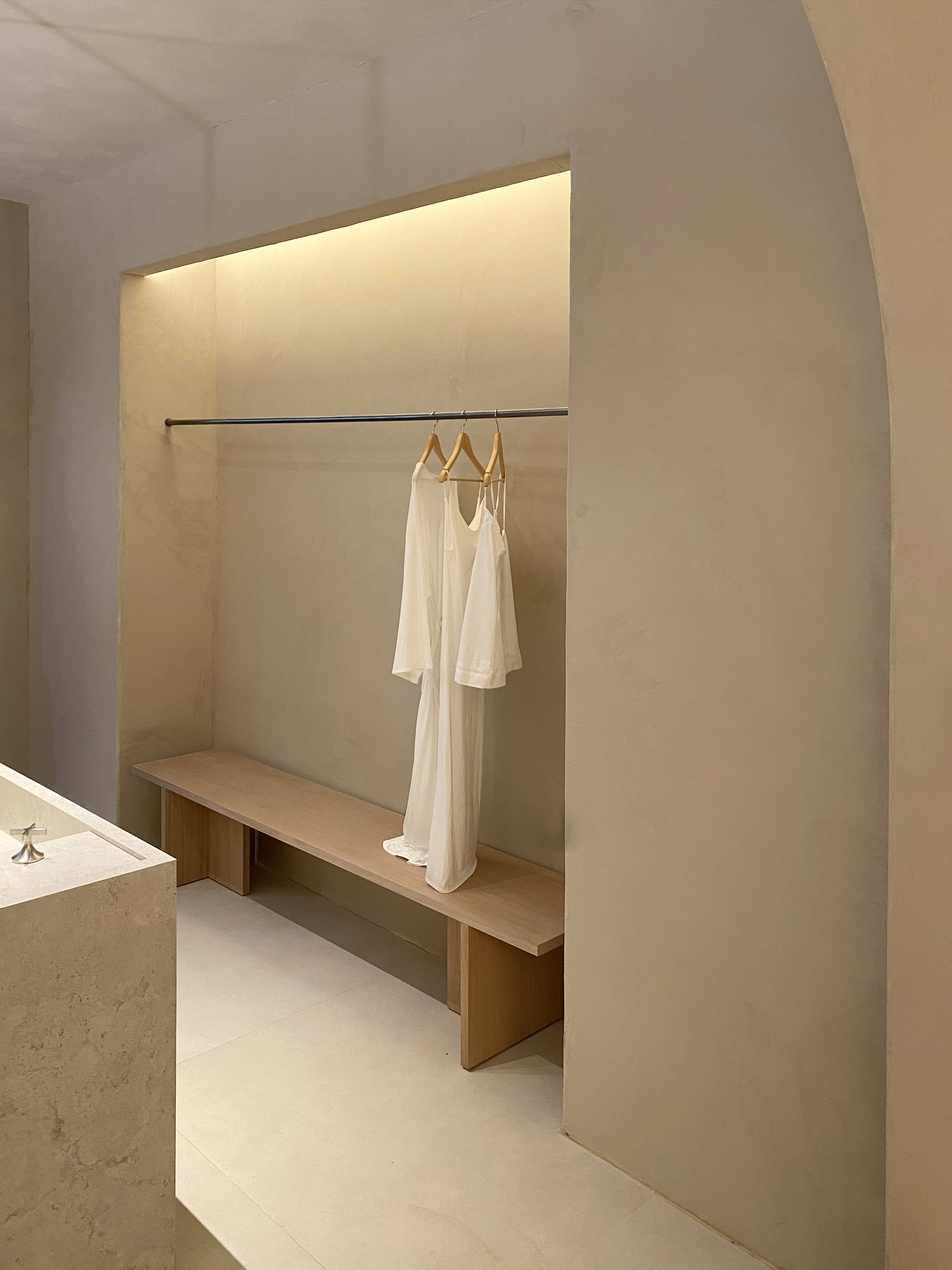 TerraVista Smooth fine-grained clay finishing plaster and TerraSilk Smooth clay paint both in Panna (cream) color applied to panels in the Mediterranean spa stand at the Marbella Design &#038; Art fair. Project by Nina Dubarry