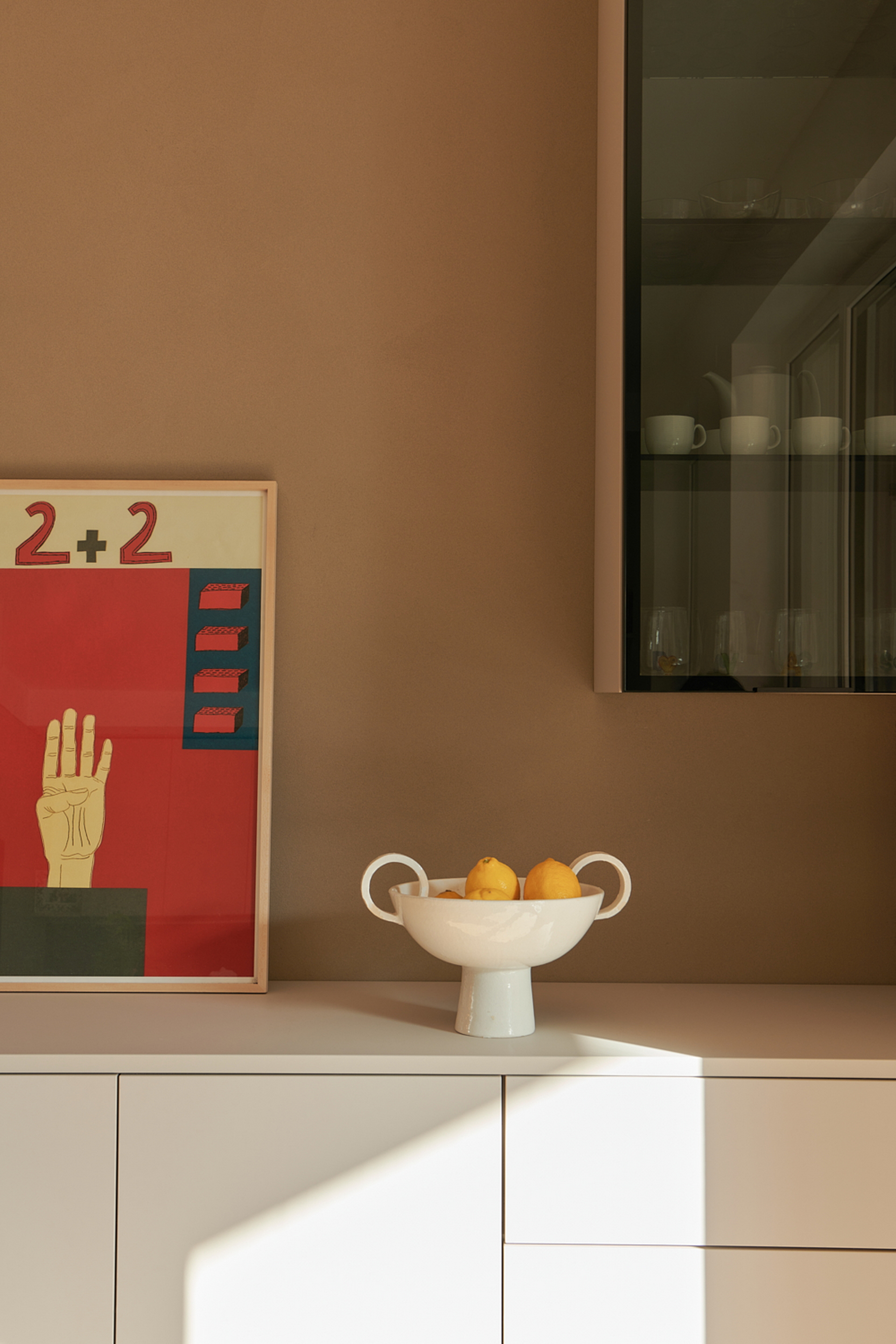 TerraVista Smooth Cannella (cinnamon color) fine-grained clay finishing plaster applied to shelves, containers and sliding panels for an interior architecture in Milan by Studio Irvine. Photography by Natalia Garcia