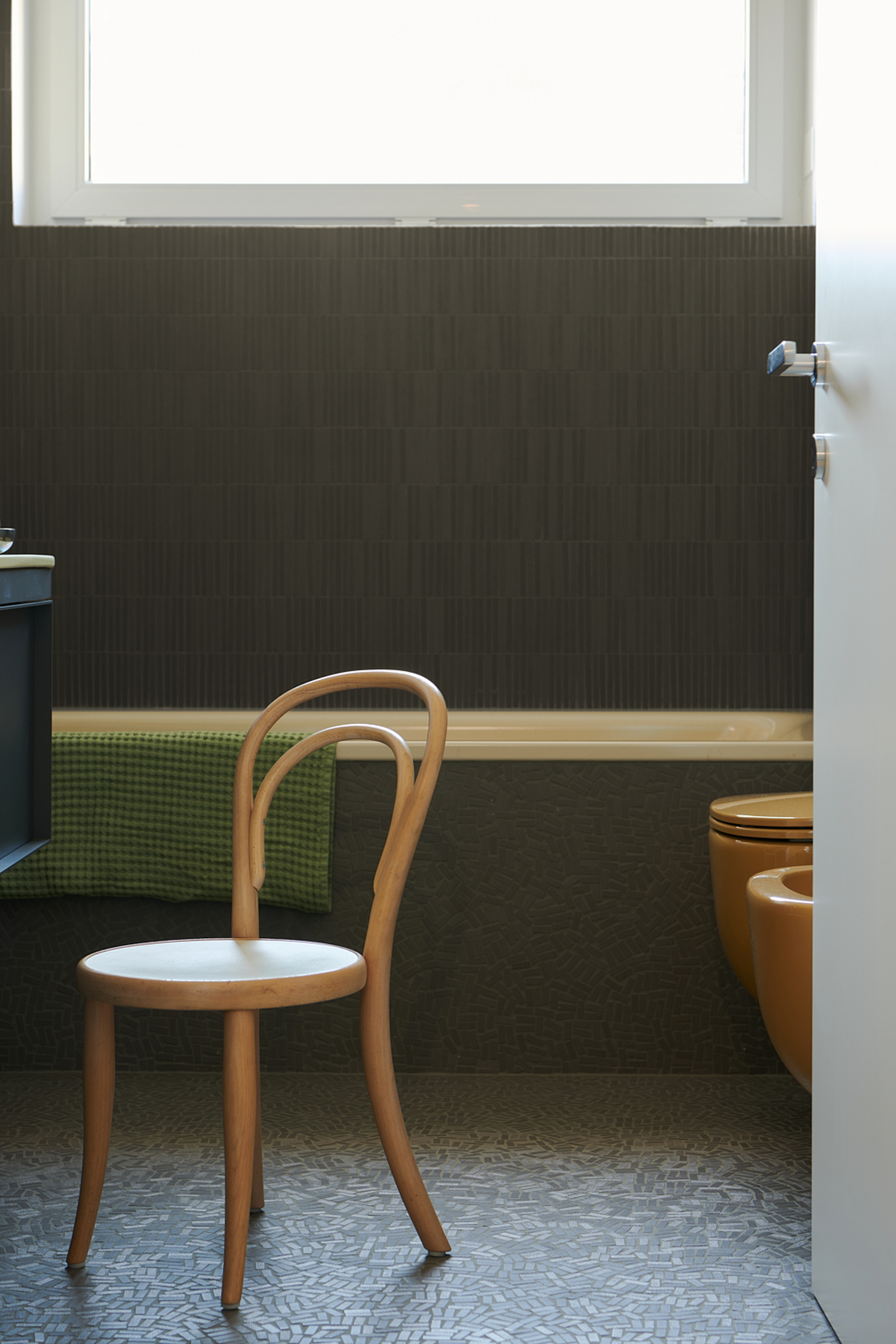 TerraVista Smooth Cannella (cinnamon color) fine-grained clay finishing plaster applied to shelves, containers and sliding panels for an interior architecture in Milan by Studio Irvine. Photography by Natalia Garcia