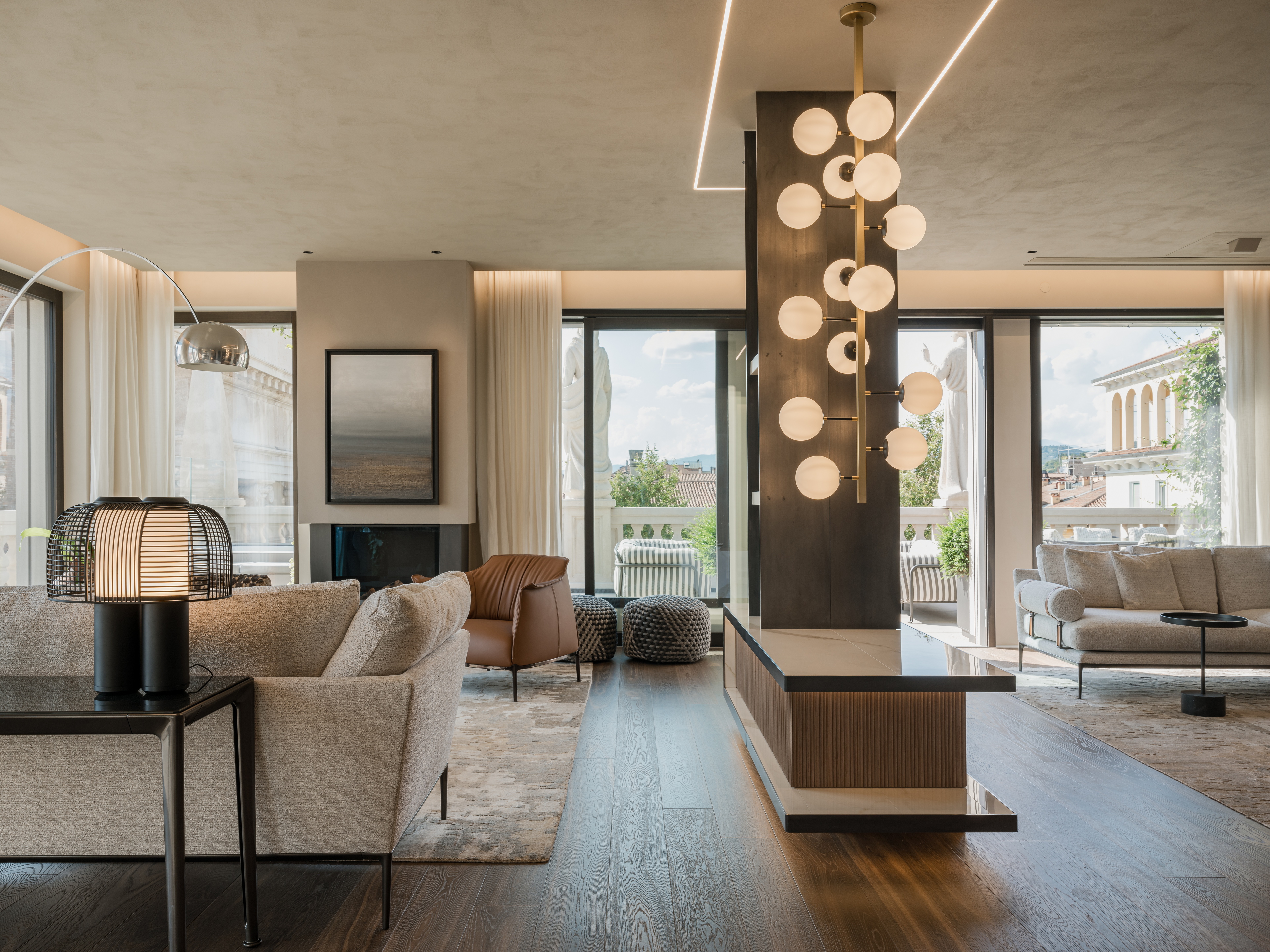 Clay finishes for a penthouse in the centre of Verona. The ceilings are adorned with natural clay paint TerraSilk Structured in Sale Grigio (grey salt) color, and the walls are finished with fine-grained clay finishing plaster TerraVista Smooth in a custom color. Project by Emanuele Soldi Architetto Photography: Michele Mascalzoni