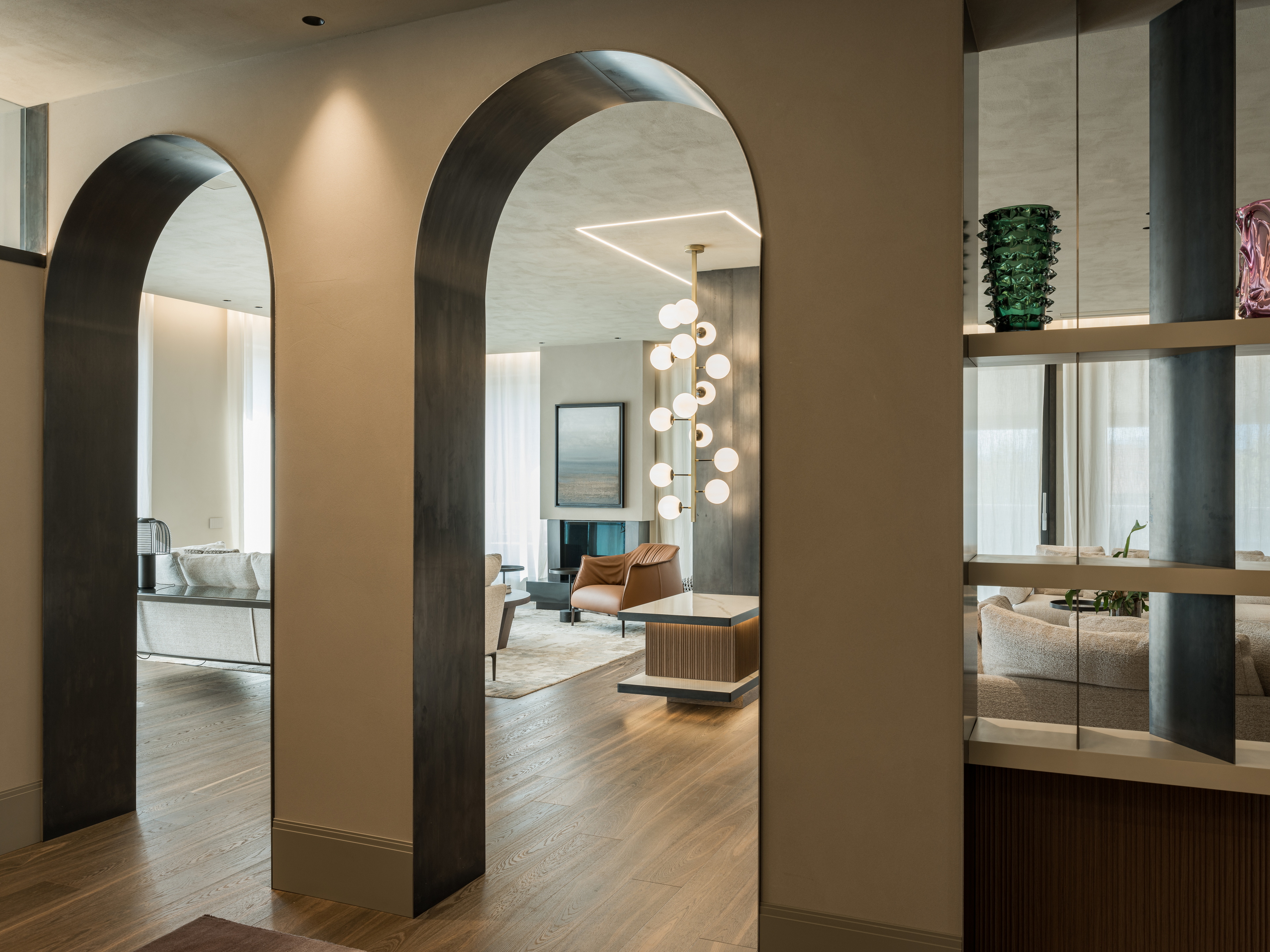 Clay finishes for a penthouse in the centre of Verona. The ceilings are adorned with natural clay paint TerraSilk Structured in Sale Grigio (grey salt) color, and the walls are finished with fine-grained clay finishing plaster TerraVista Smooth in a custom color. Project by Emanuele Soldi Architetto Photography: Michele Mascalzoni