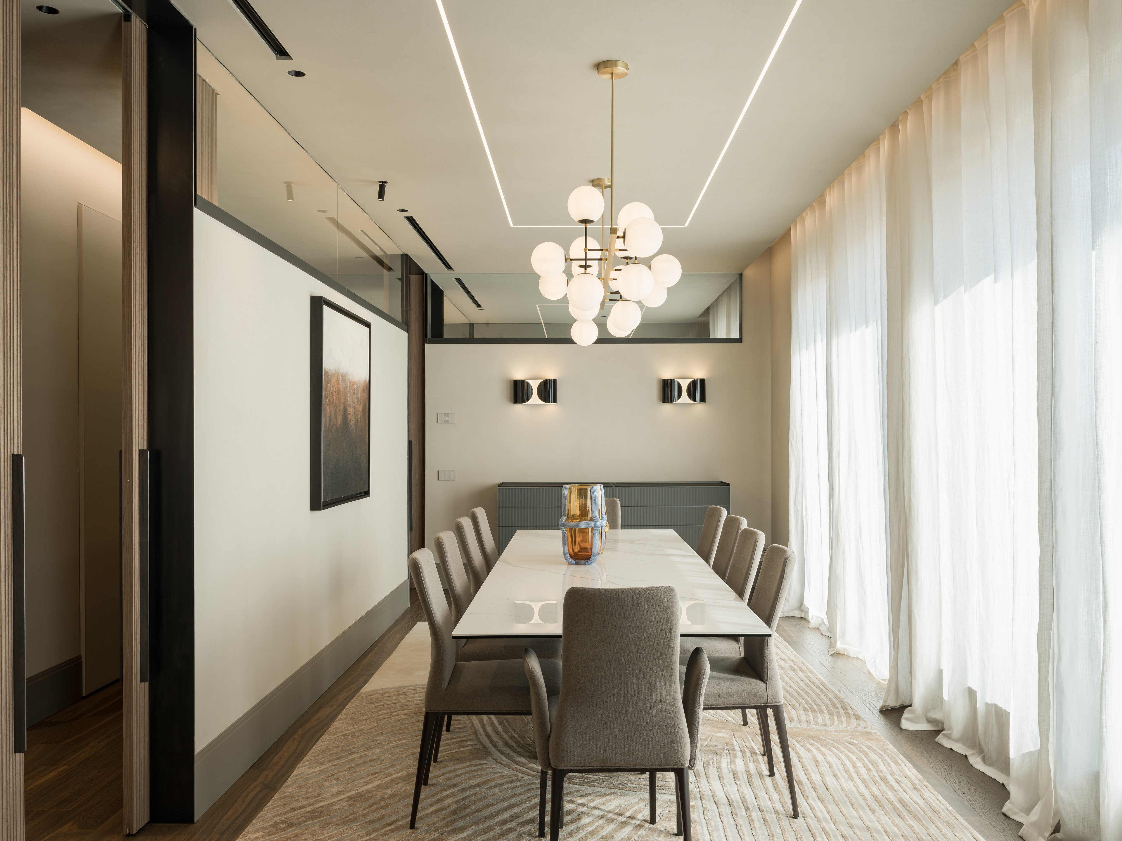 Clay finishes for a penthouse in the centre of Verona. The ceilings are adorned with natural clay paint TerraSilk Structured in Sale Grigio (grey salt) color, and the walls are finished with fine-grained clay finishing plaster TerraVista Smooth in a custom color. Project by Emanuele Soldi Architetto Photography: Michele Mascalzoni